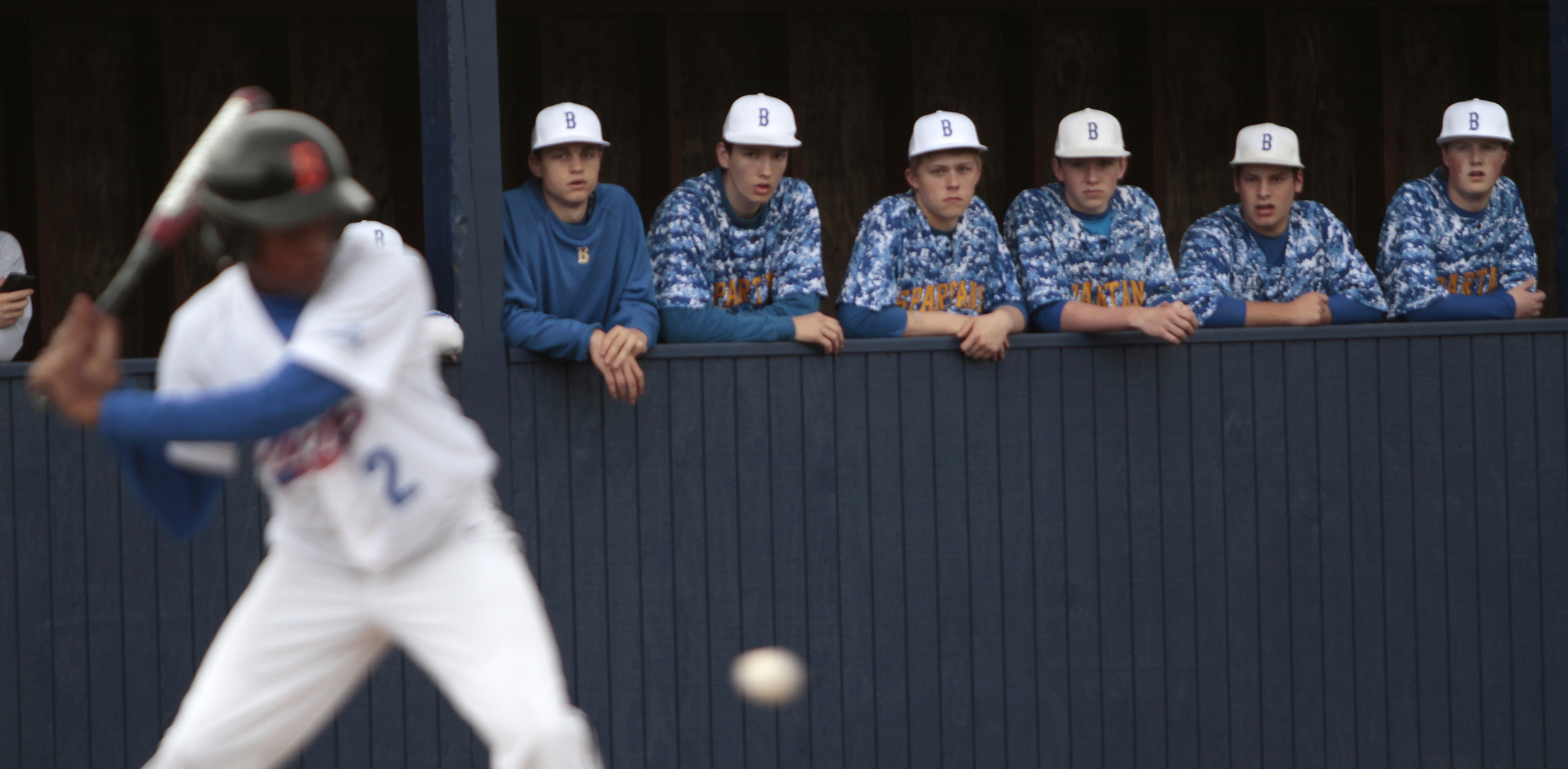  The Bainbridge Spartan dugout watches a Rainier Beach visitor at bat.&nbsp; 