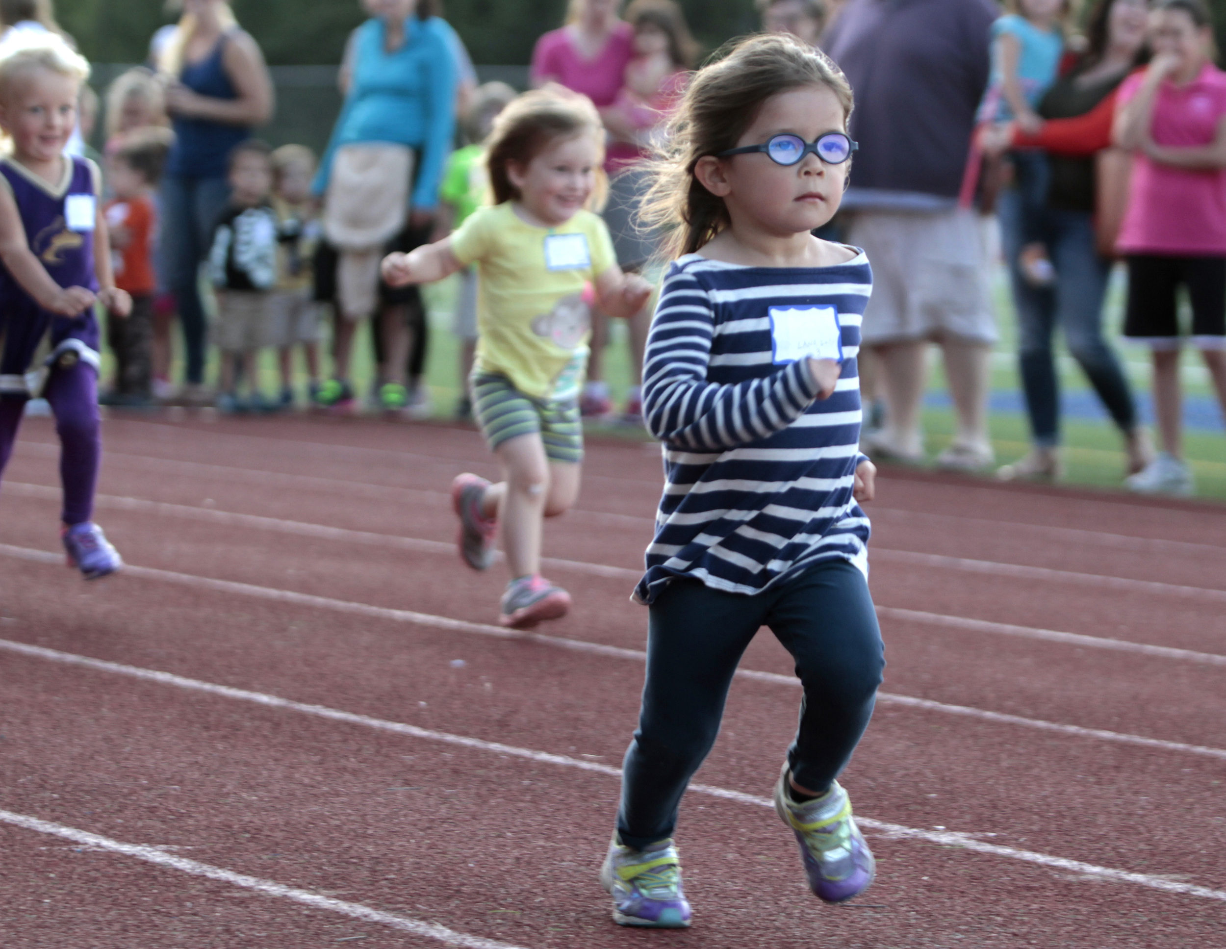 Lana Evans, 3, way out in front during the girls 60-meter dash event at the first Kiwanis All-Comers track meet of 2016. 