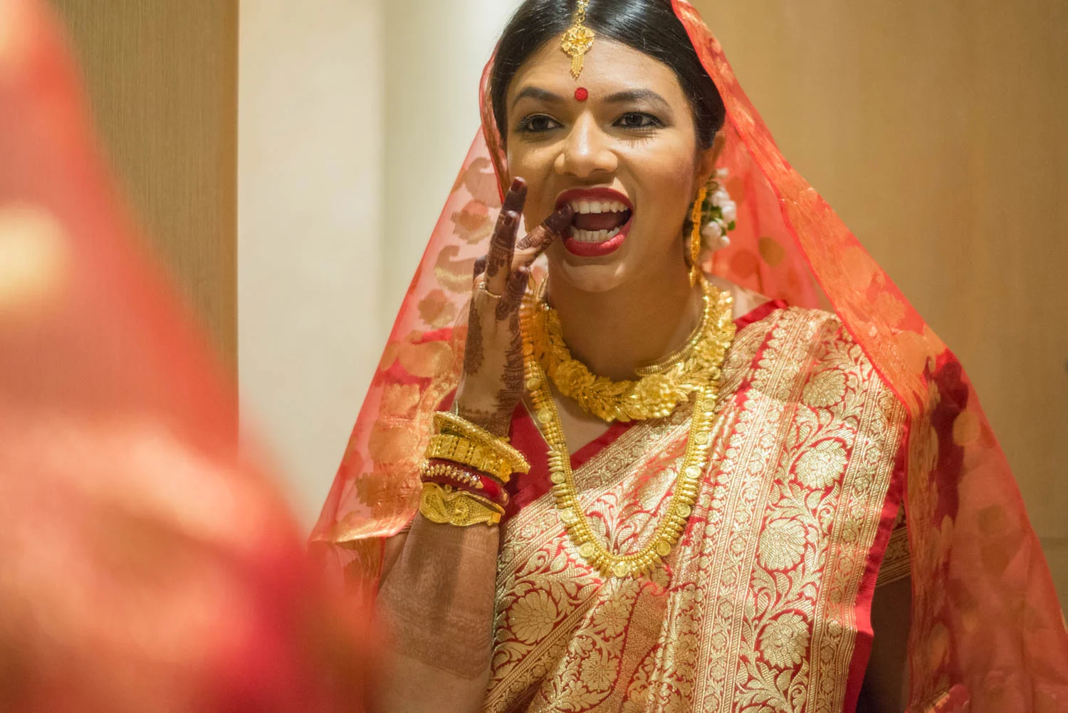 Even goddesses get lipstick on their teeth sometimes. 