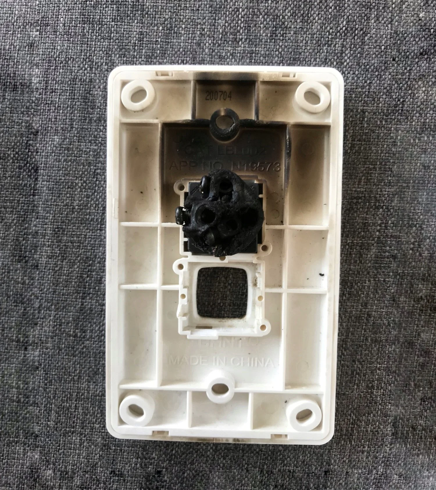 The customer's damaged electrical switch, which almost led to a house fire.