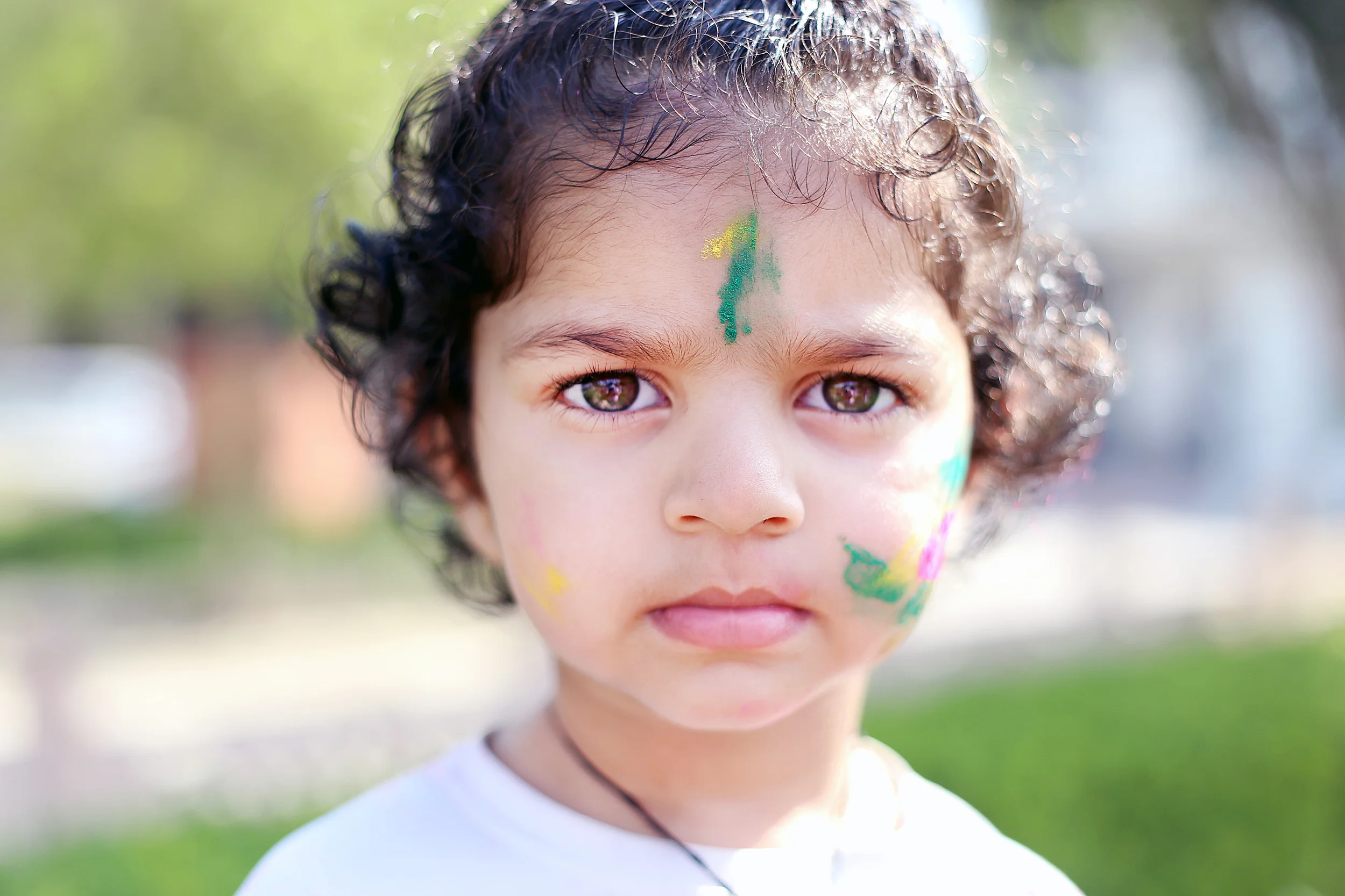 Child celebrating Holi - Mathura, India