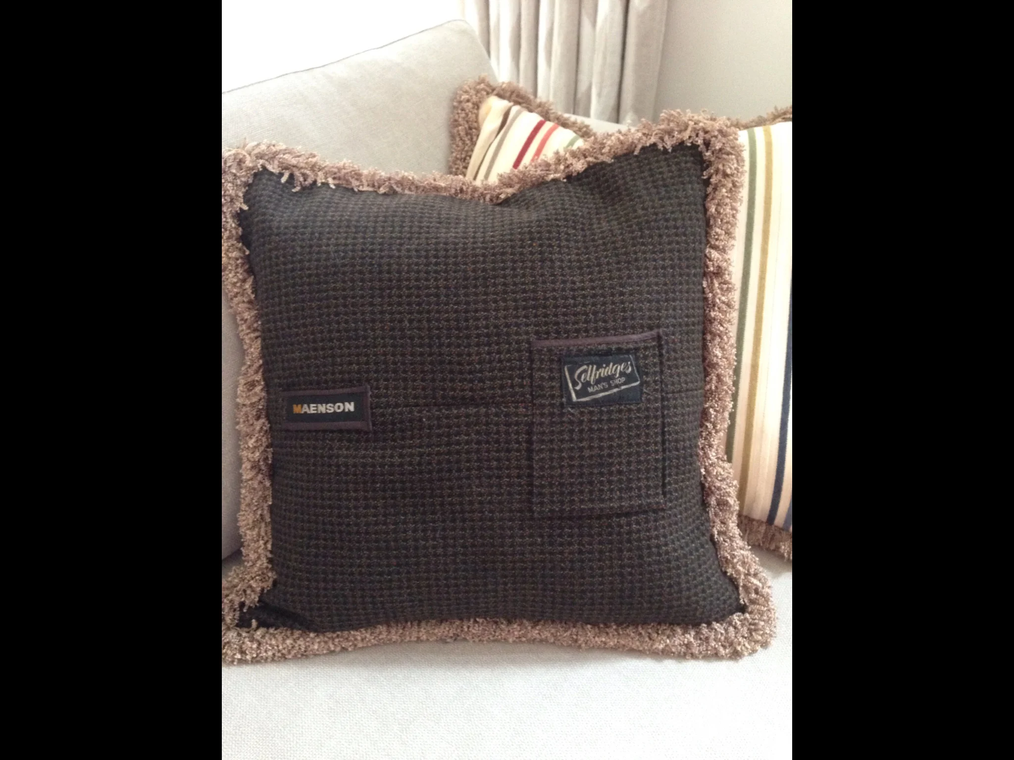 On this one you can see the use of the inside pocket and Selfridges label