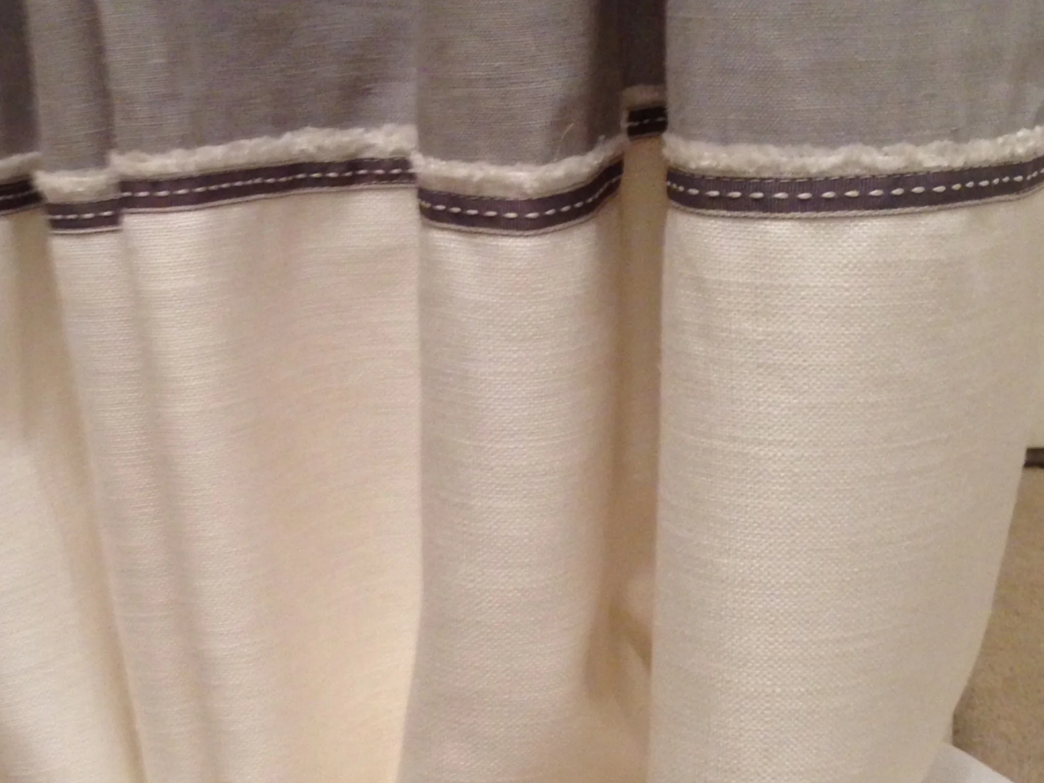 Braid detail on the bottom of the hall curtains. We loved the frayed detail of the selvage so we left it showing.