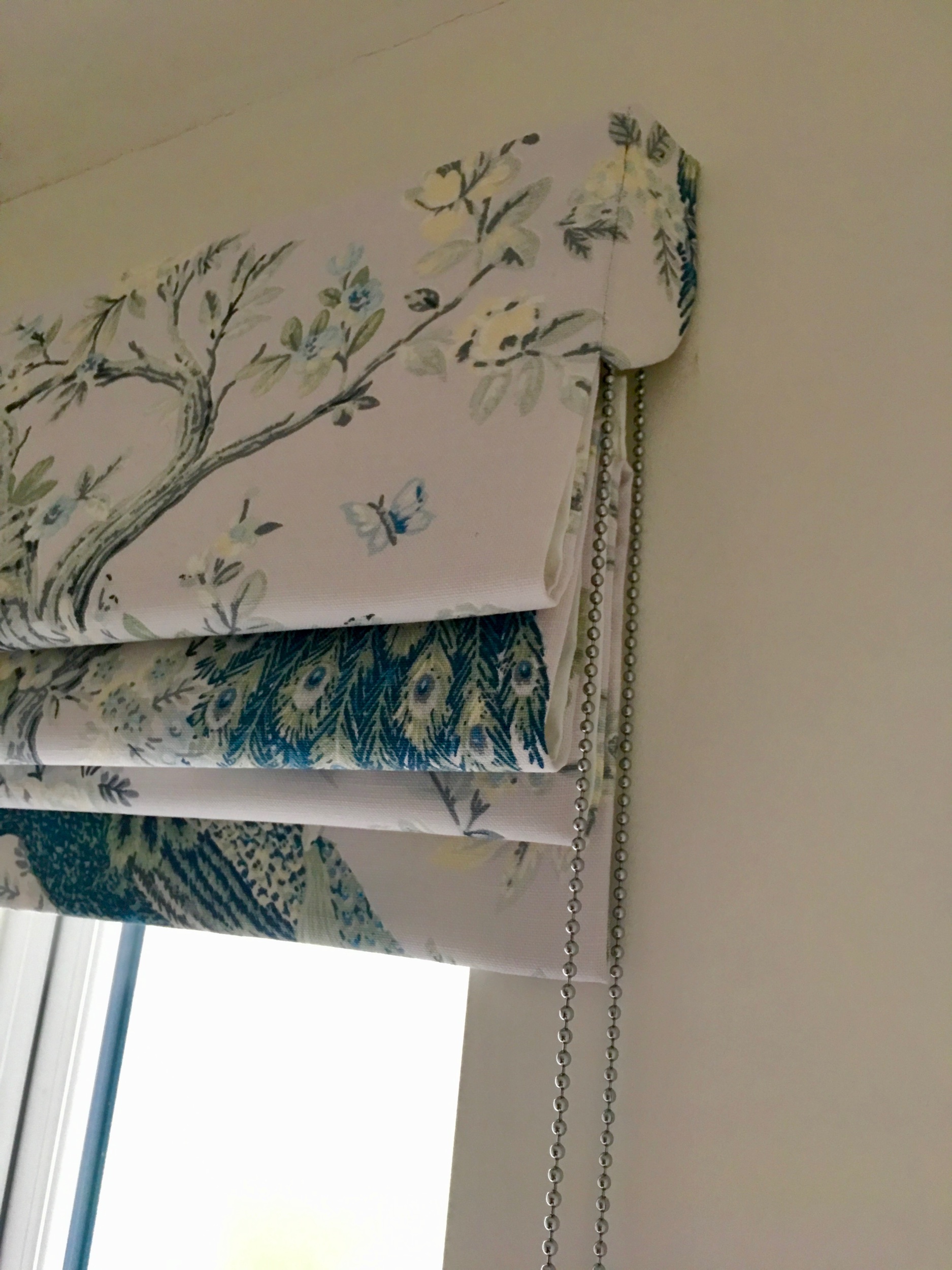 Carefully pattern matched side returns give a streamlined look to the Roman blind