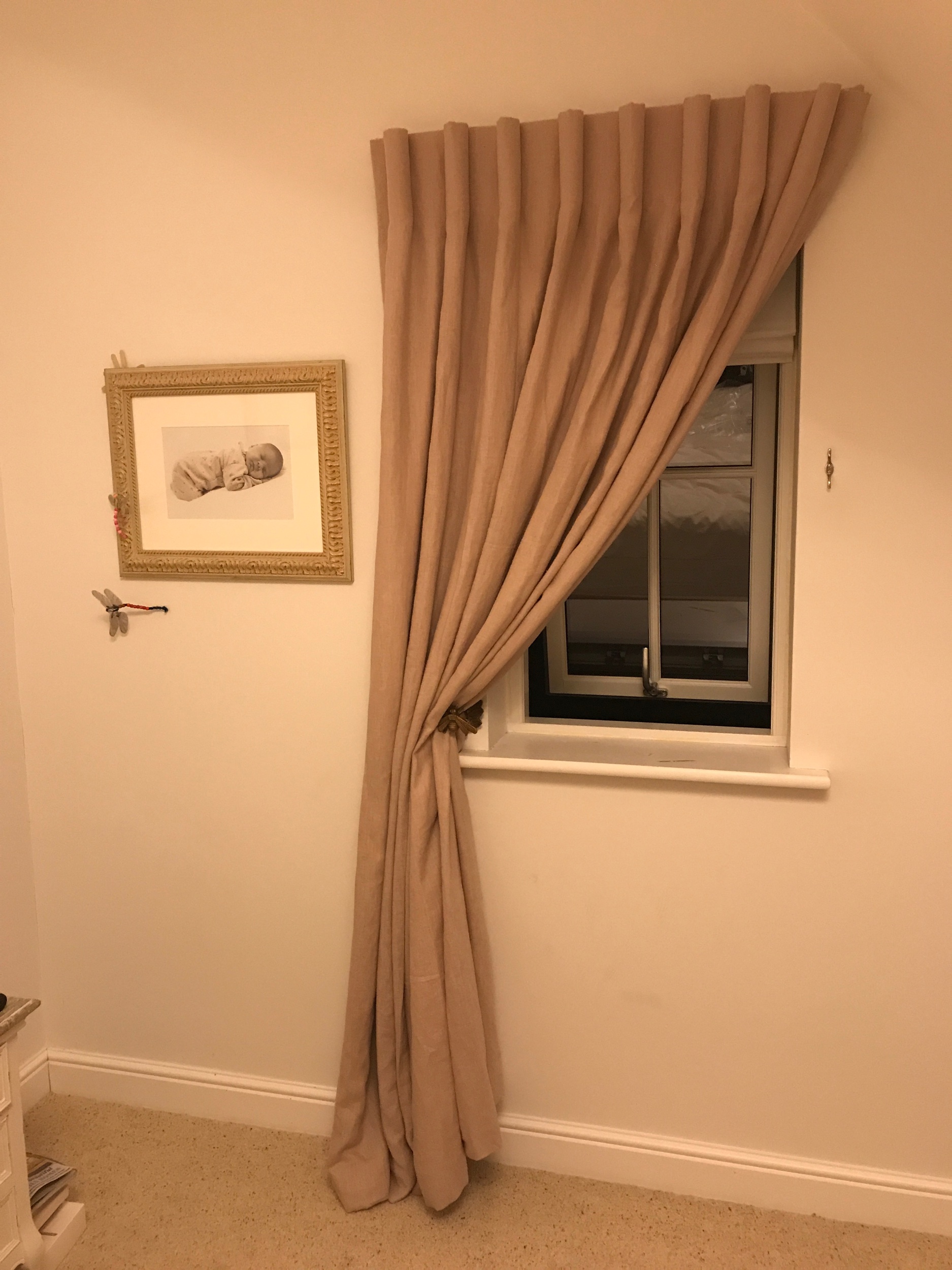 Single curtain swept to one side