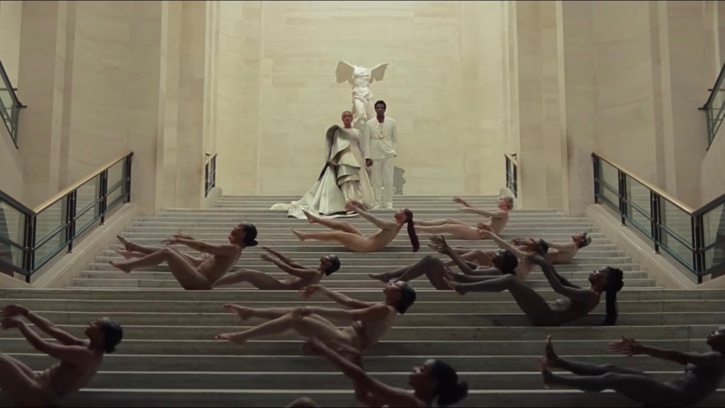 A still from "Apeshit," Beyoncé and Jay Z stand with The Winged Victory of Samothrace.