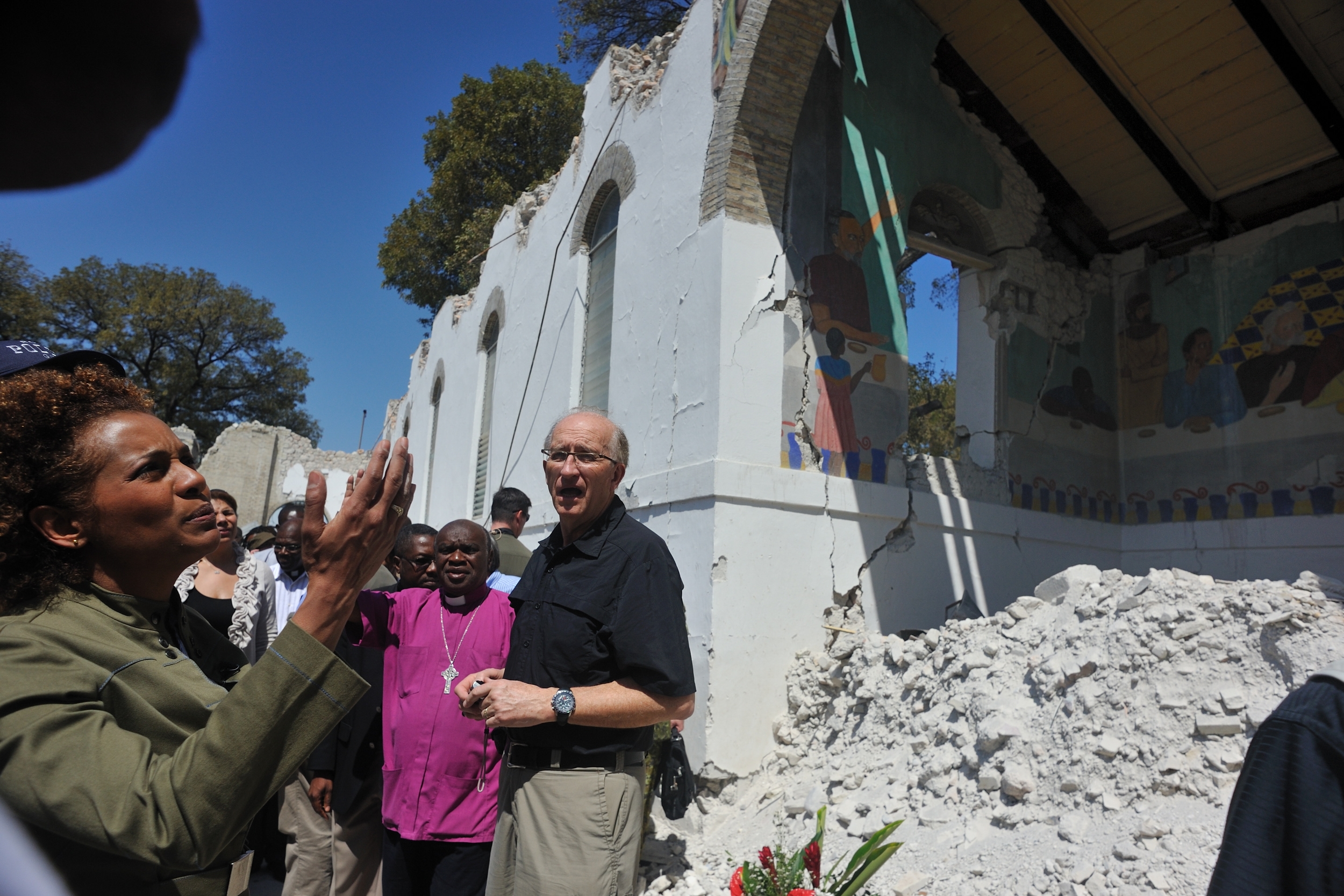 Their Excellencies visit locations in Port-au-Prince including the Cathédrale Épiscopale and the Sainte-Trinité school.