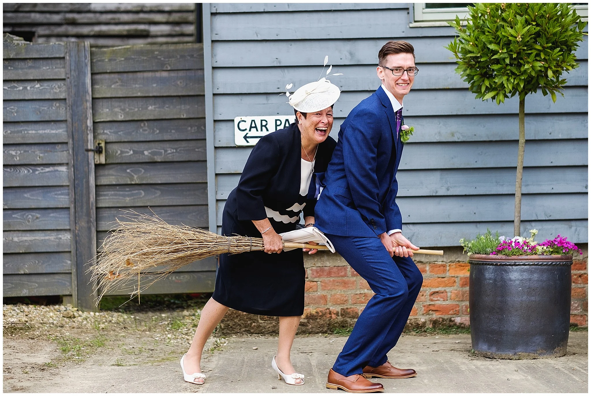 Groom and mother in law on broomstick