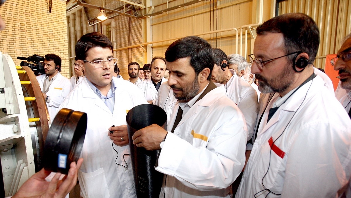 Iran's former president, Mahmoud Ahmadinejad inspects a carbon-fiber centrifuge rotor made possible by increasing globalization of previously sophisticated technologies. Photo: president.ir