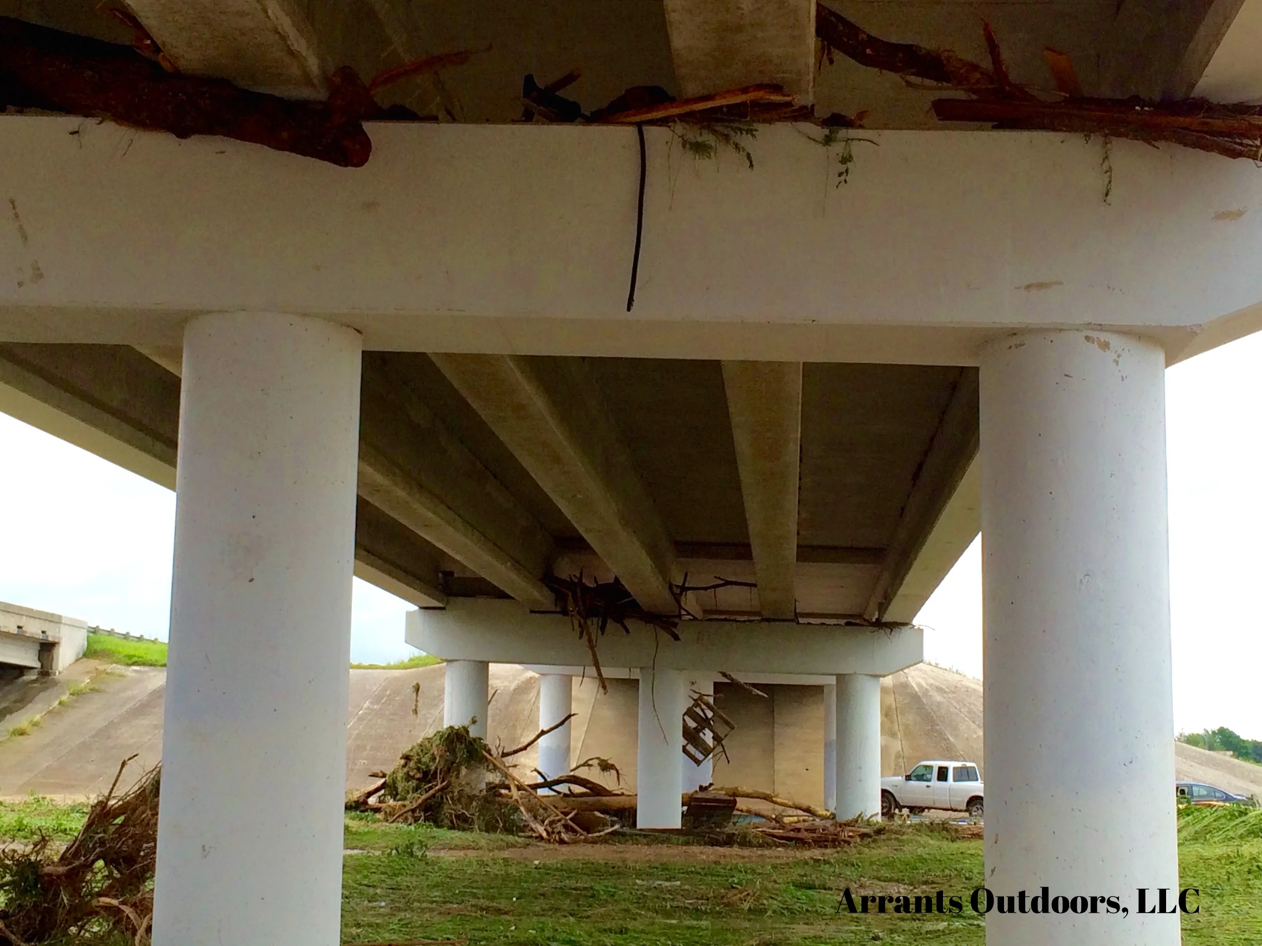 Debris under the bridge, even lodged underneath the bottom. (Click to enlarge)