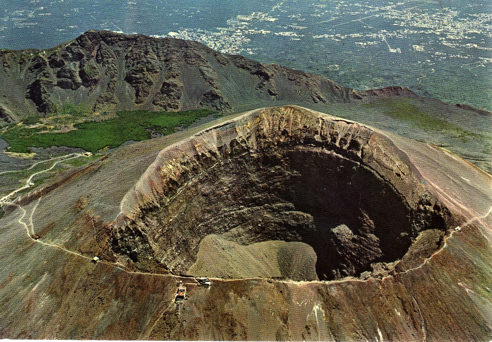 VESUVIUS Vesuvius (Italian: Monte Vesuvio) is a volcano near Naples. Vesuvius is 1.281 meters tall. In our opinion Vesuvius is one of the most exciting volcanoes to see in Italy. It is really beautiful. If you are in the area of Naples we highly recommend you go see the volcano.