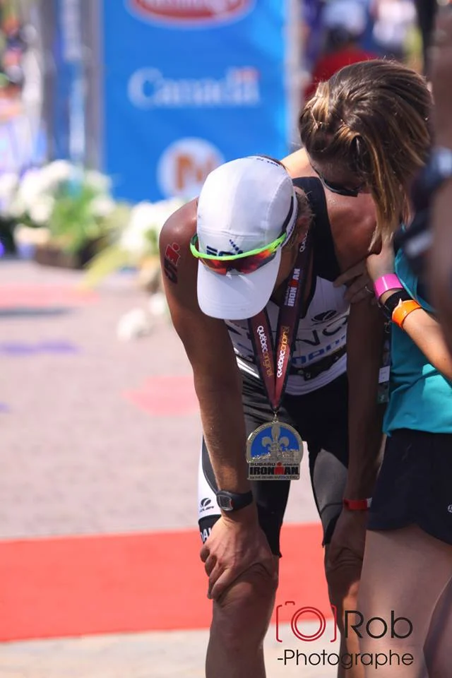 My wife, Brooke, greeting me at the finish line. I felt rough. Photo Credit: Robert Mahaits.