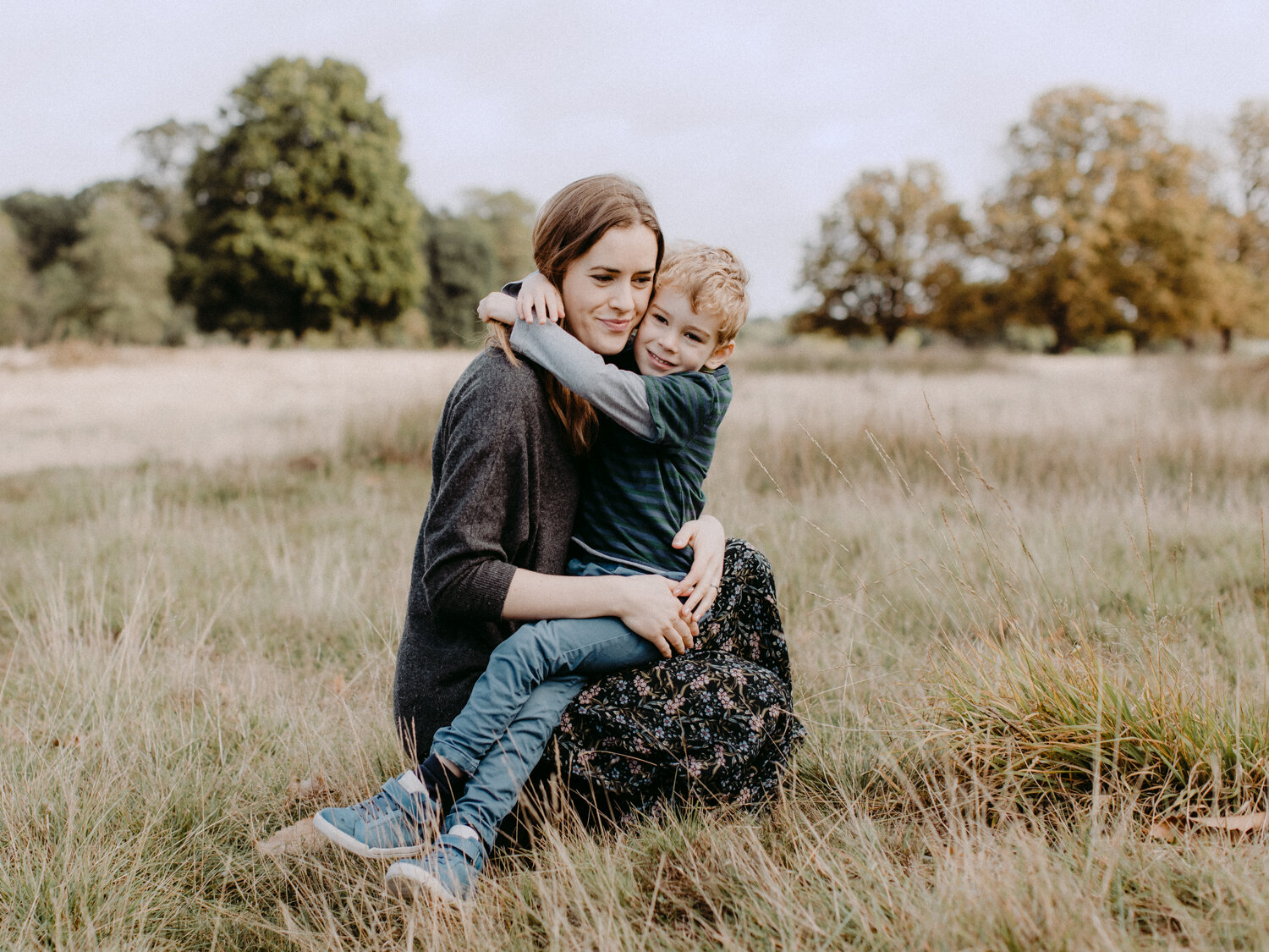 mother holding her son in richmond park