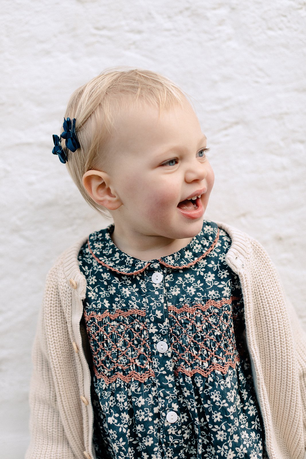  Portrait of toddler smiling at family photoshoot in Pembroke Lodge, Richmond Park 