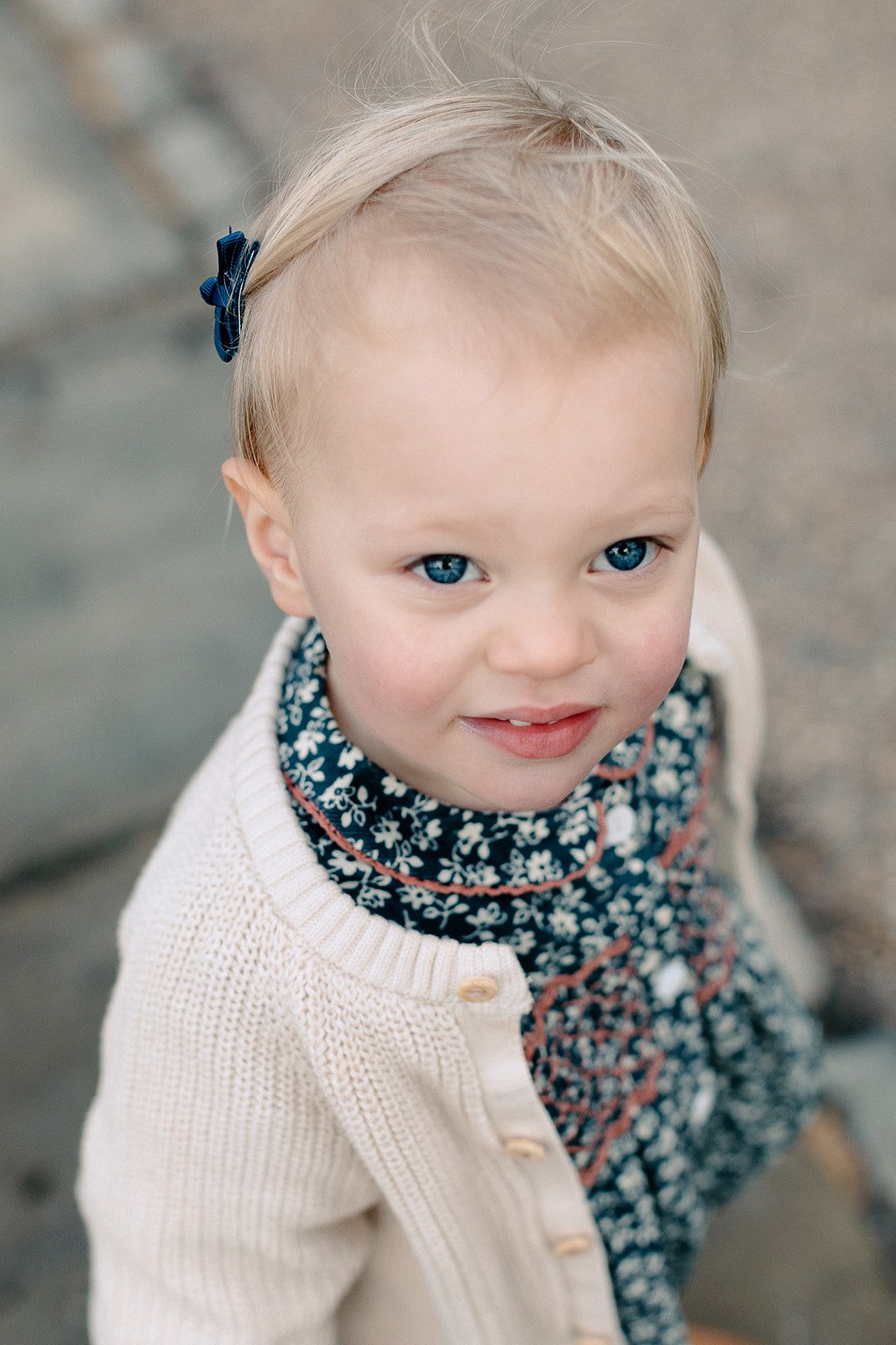  Portrait of toddler smiling at family photoshoot in Pembroke Lodge, Richmond Park 