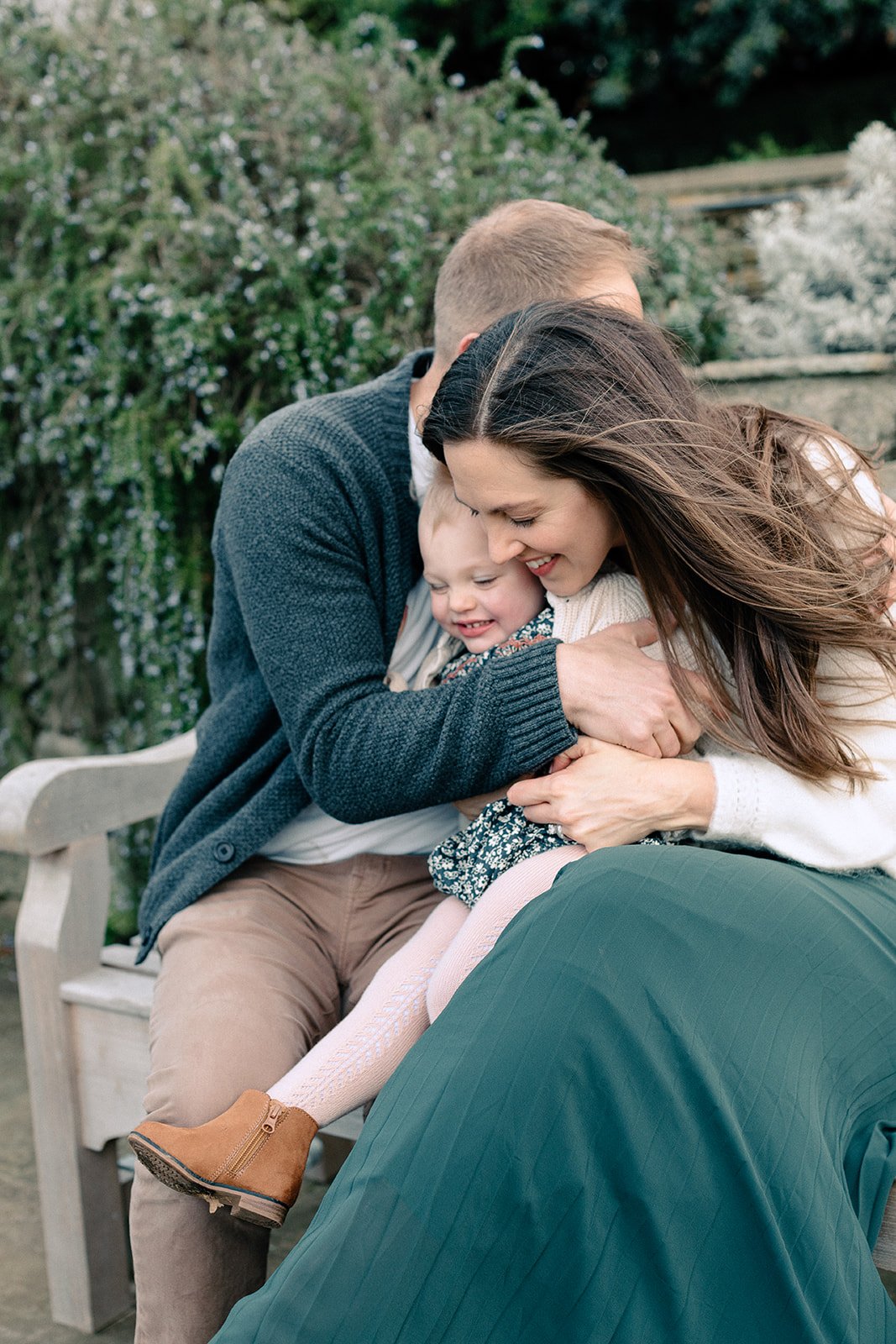  Family photographer captures family embracing in richmond park London 