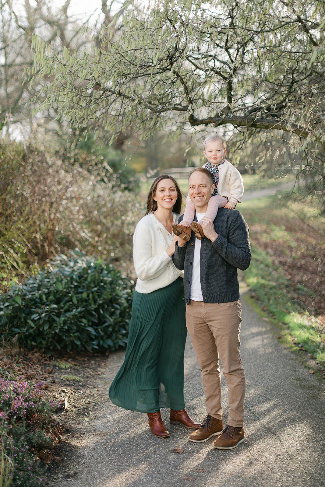  Family photographer portrait of family smiling in richmond park London 