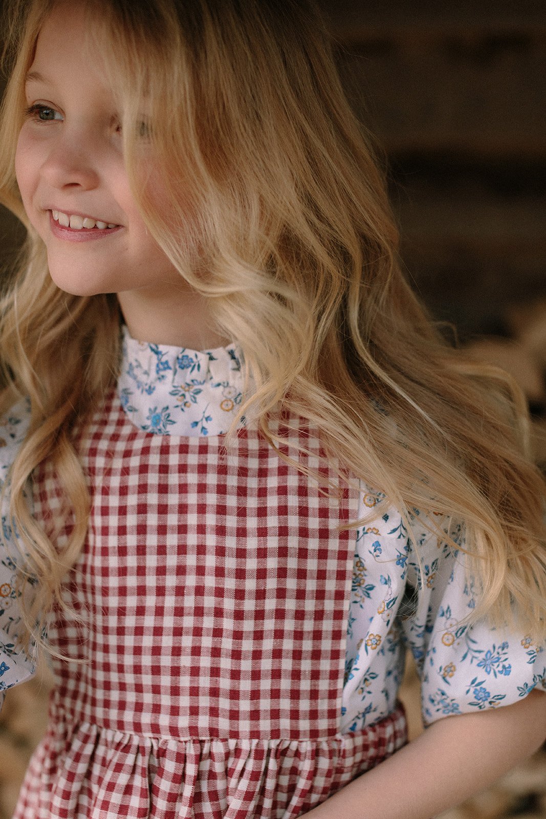  childrens fashion photographer girl in red gingham dress 