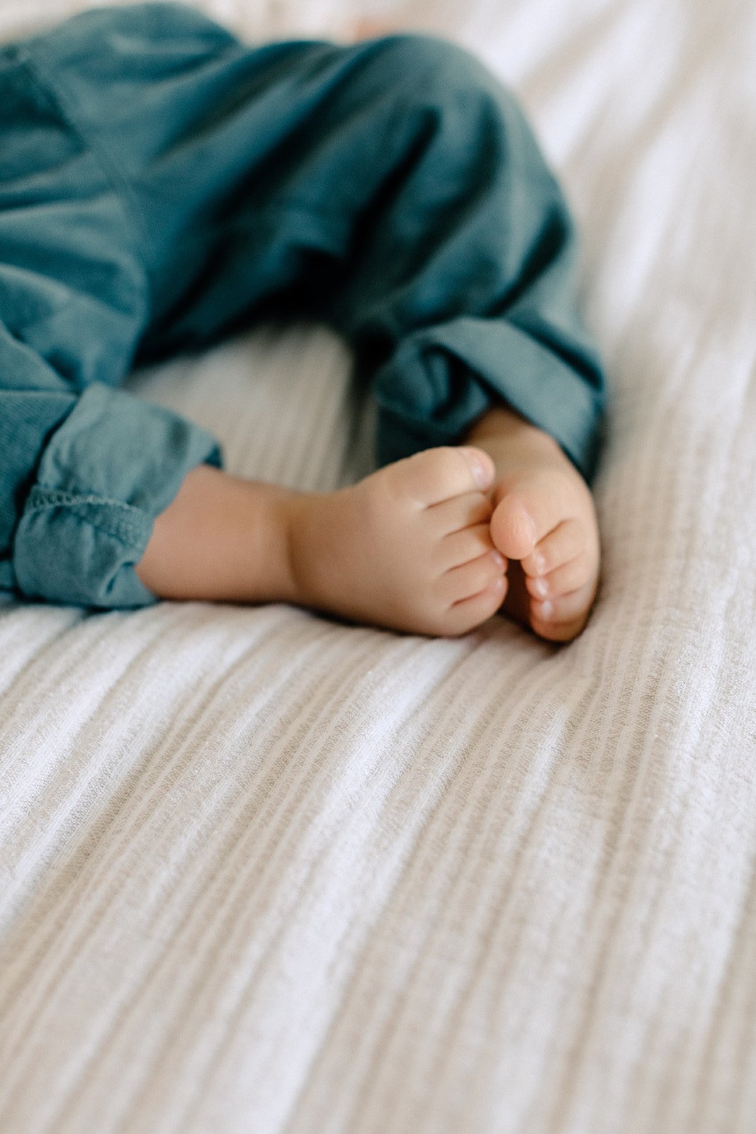  toddler toes on bed at family photography shoot in tunbridge wells 