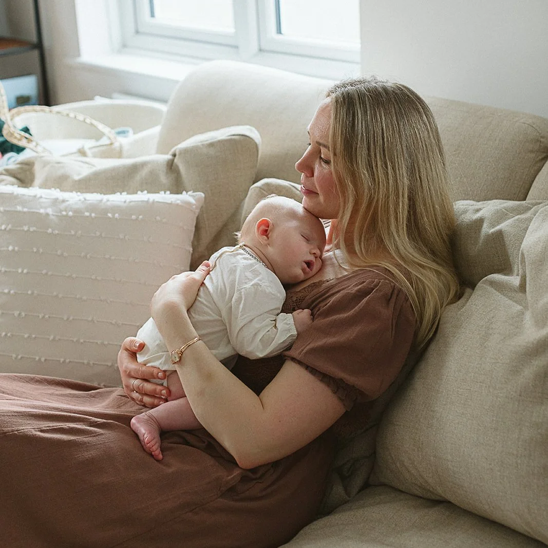 newborn-photographer-tunbridge-wells-mother-holding-newborn.jpg