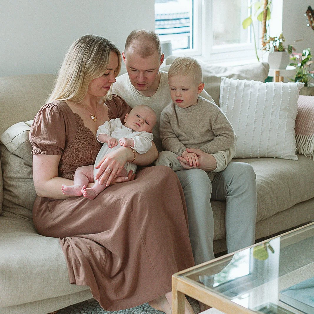 newborn-photographer-tunbridge-wells-family-on-sofa.jpg