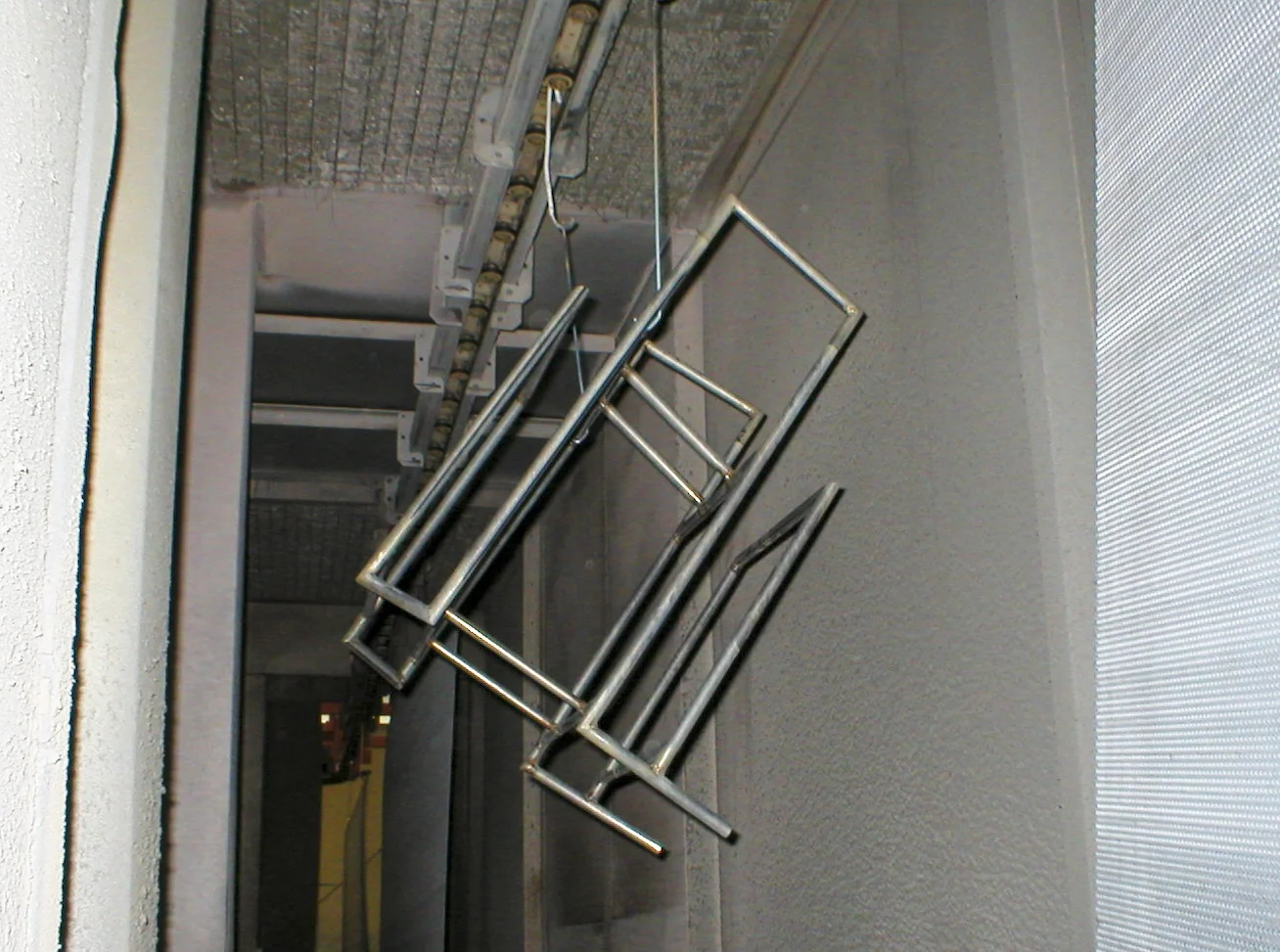 Frame in the process of being powder-coated