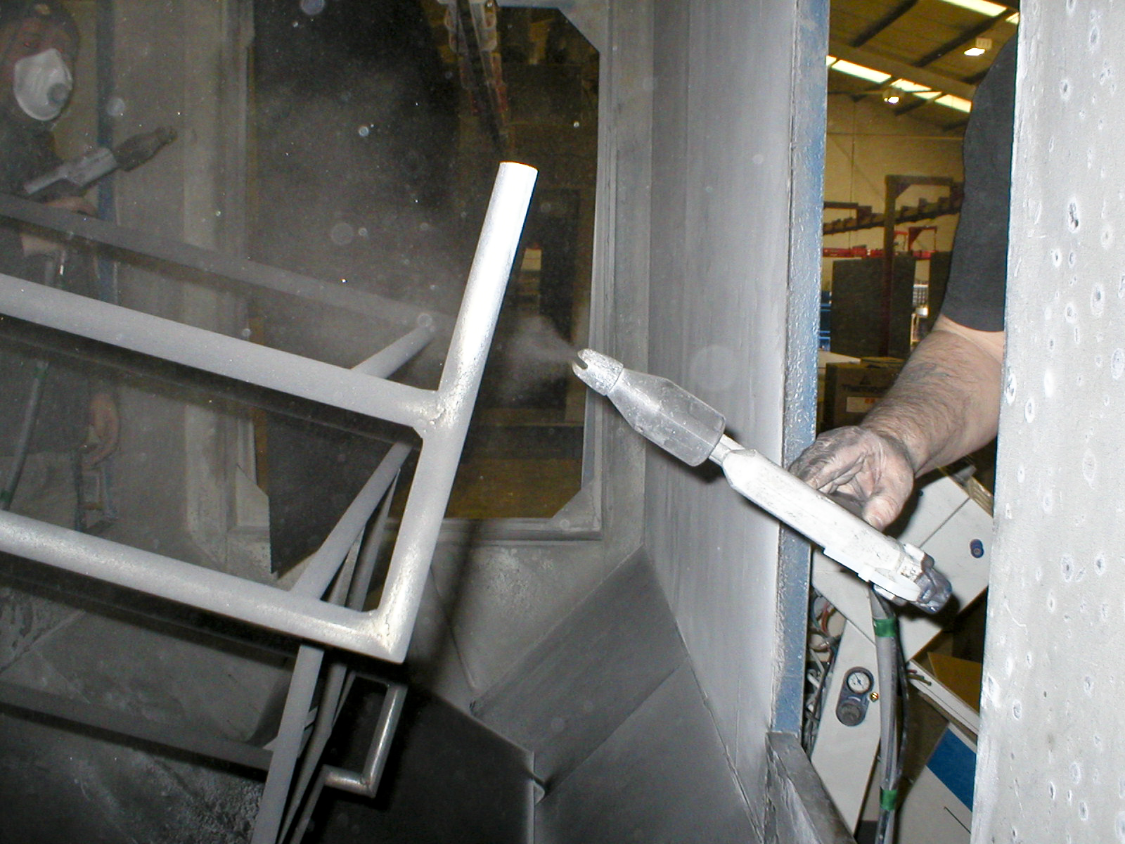 Frame in the process of being powder-coated