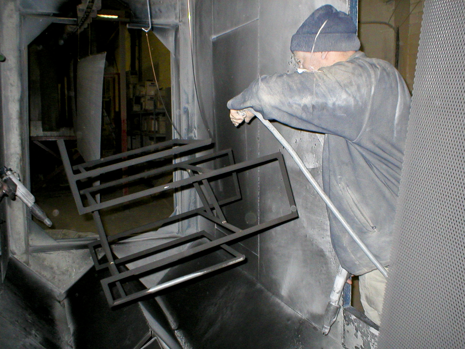 Frame in the process of being powder-coated
