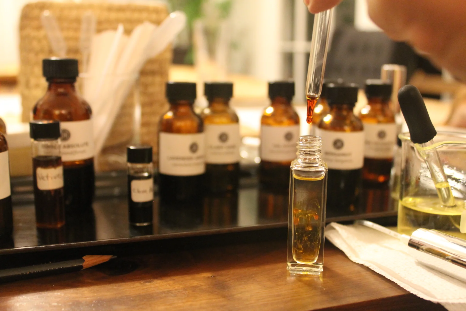Jessica Hannah performs modern alchemy as she drops essential oils into each participant's vile.