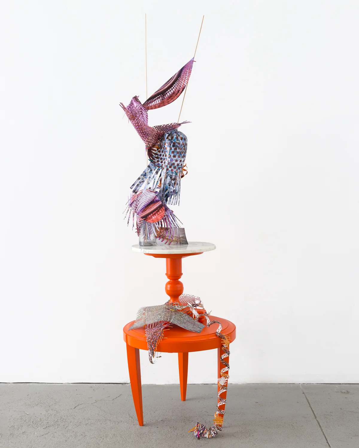   Echo-mesh-swing-skep , 2015  cut-up inkjet prints, wood and marble table, wood table, c-print, glass bottles, wooden dowels, miniature clothespins  86 x 25 x 25 inches   Twist-flip-tremble-trace , Johalla Projects, Chicago, IL     