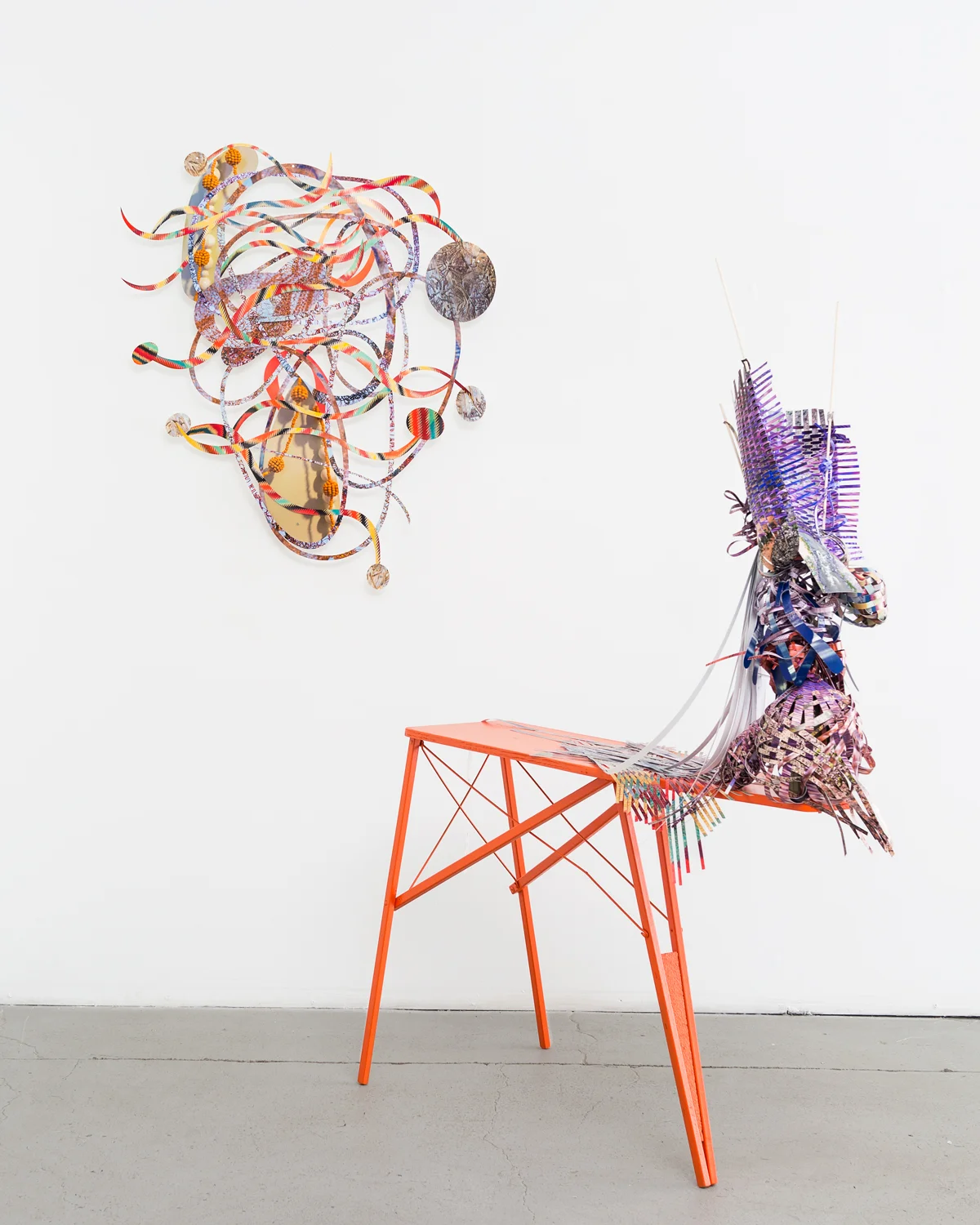  Interlacing-rapid-mouth , 2014  cut-up pigment prints, wooden dowels, plastic netting, wooden ironing board, and glass bottle  72 x 32 x 11 inches  &nbsp;  on the wall:   Woven patter , 2013  cut-up pigment prints  47 x 37 inches   Twist-flip-tremb