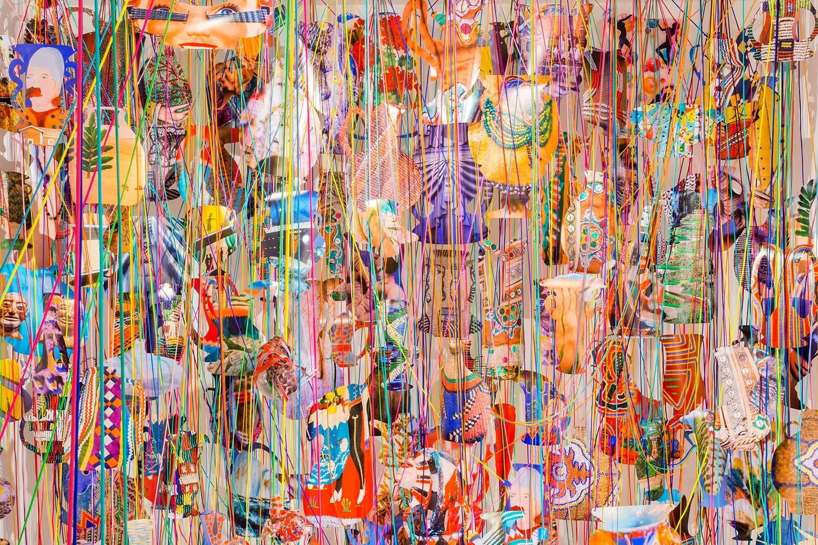   Collecting Within , 2016  cut-up inkjet prints, paracord, mason line, wooden dowels, miniature clothespins, party lights  dimensions variable   MoCP at 40 , Museum of Contemporary Photography, Chicago, IL 