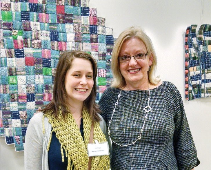 Deborah Kuster of Conway, right, professor of art at the University of Central Arkansas in Conway, seen with former student Marianne Nolley at the opening reception for Form in Fiber. Kuster and Nolley both have works in the show. 