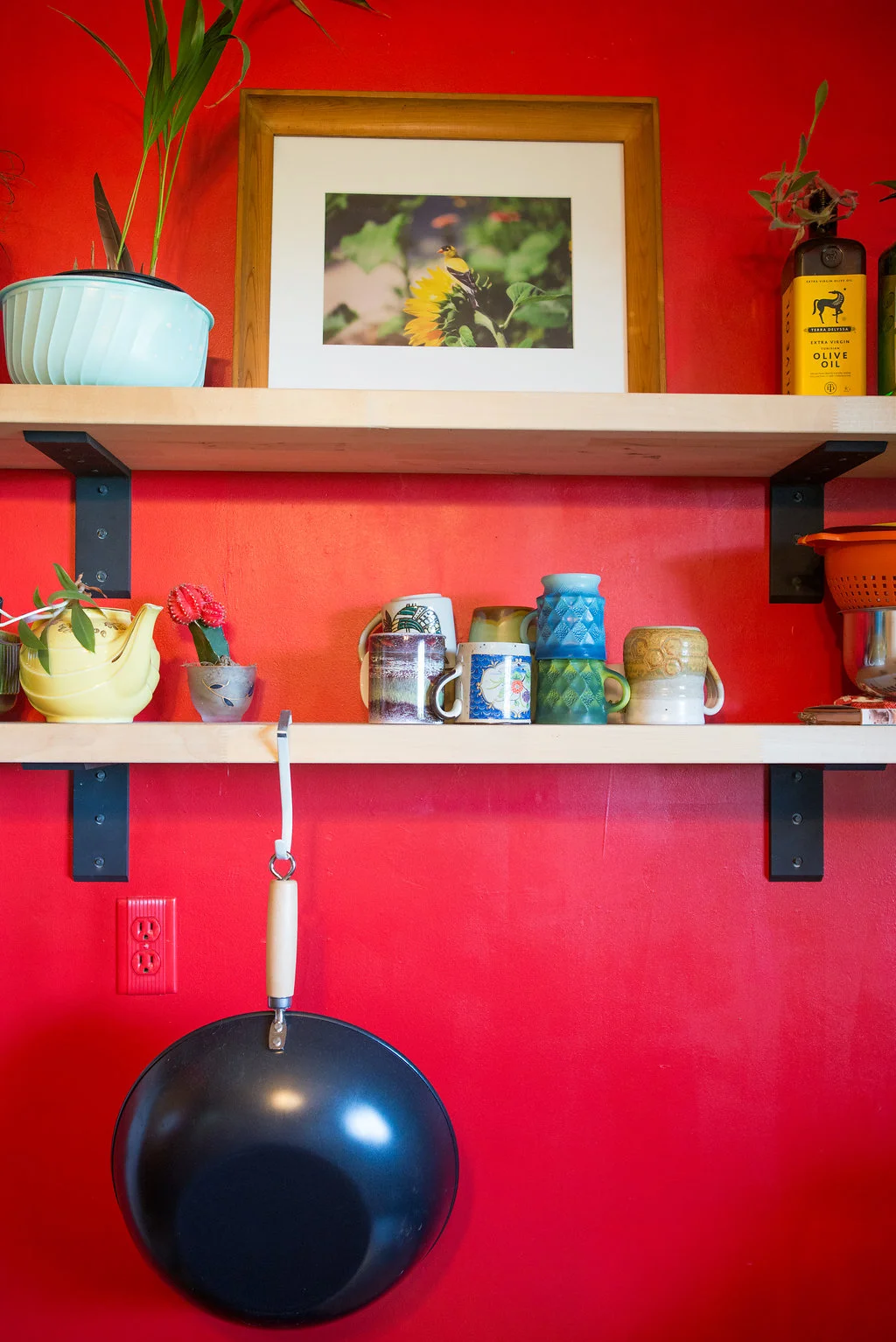 Tytia's lovely yellow finch photo helps to subdue the angry red wall. Don't get me wrong - I love red - but looming on a wall like this? No. My thoughts, anyway. Rob says it energizes him. We've come up with a compromise plan, but just haven't had the time or energy to execute it. 