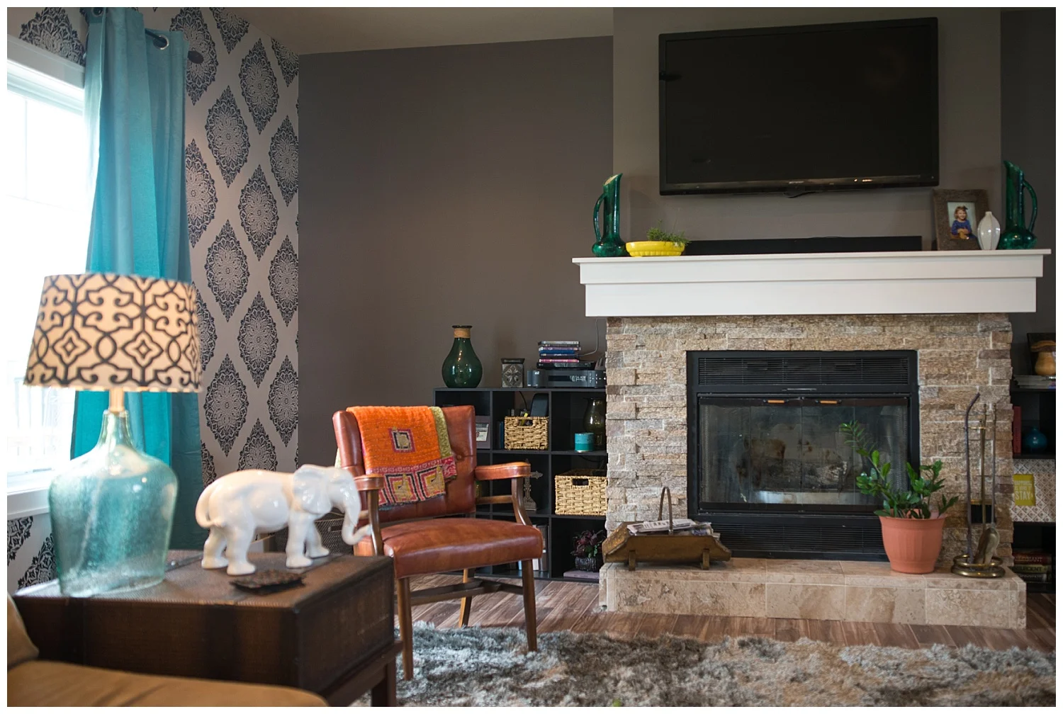 Notice something funny with the curtain? Salina was in the process of deciding which color she liked best - navy, turquoise or natural - when Tytia took the photos. She's going with the navy. She's also in the process of having built-ins made to flank the fireplace. Watch this space to see how that will totally change the look of this room. 
