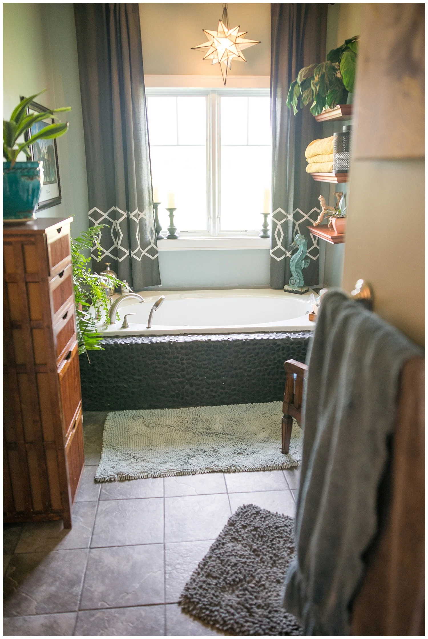 I had no idea this spa-like en suite existed until we did this photo shoot. Pretty sure I could live out my days in just her bedroom and bathroom. That fabulous black rock tub? They did it themselves. These two are legit DIYers.