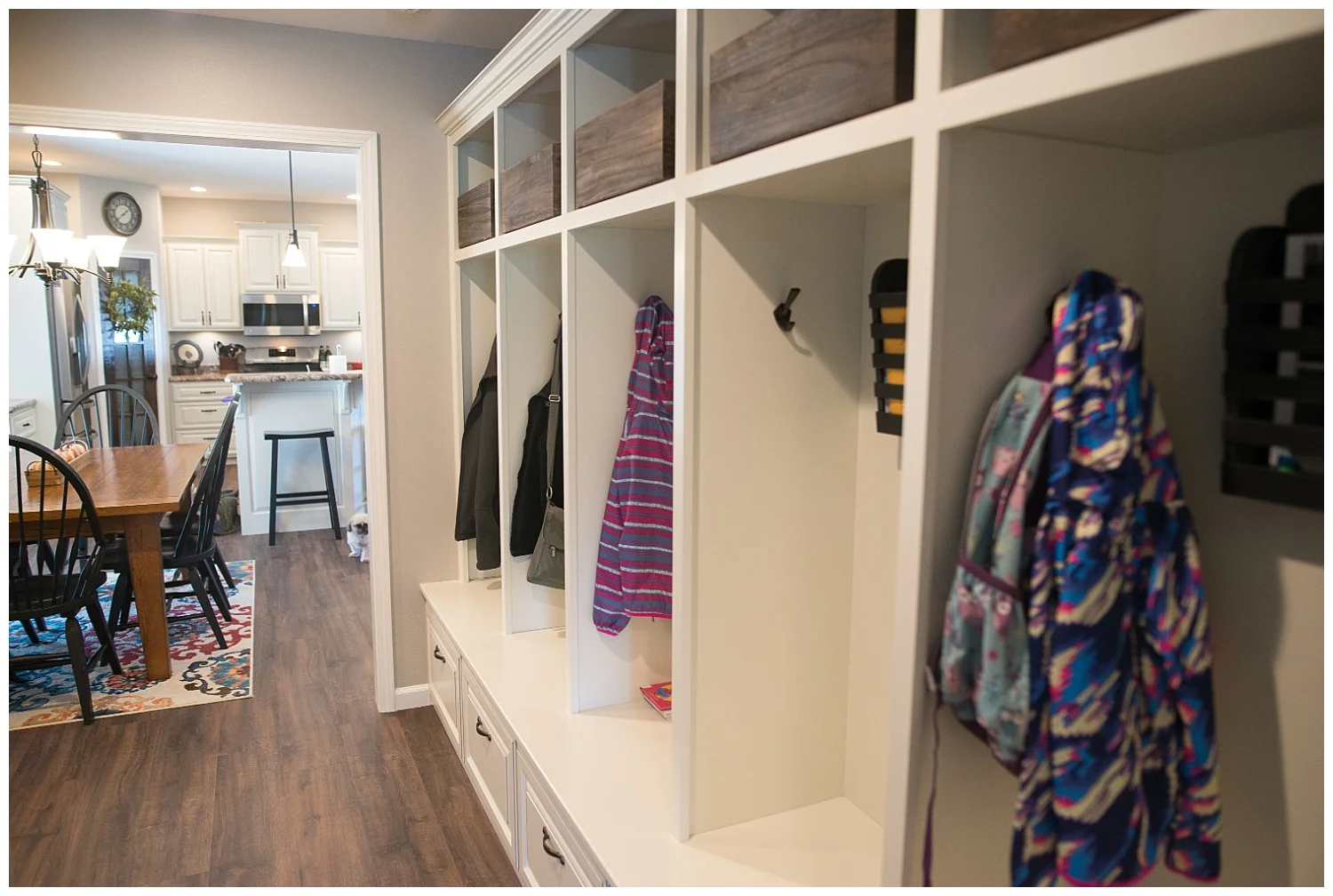 Check out that storage! In order to tame household clutter Elizabeth had a local builder create a cubby for each family member. The racks came from Etsy. She says she often tells the kids to "clean out your locker". : )