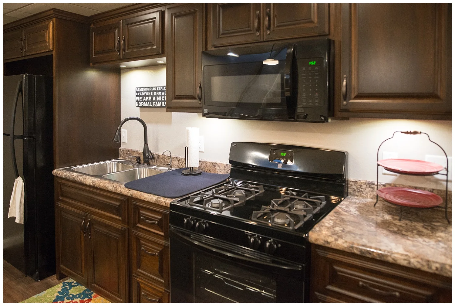 Yep, she put in another kitchen in the additional family space. In true Elizabeth fashion she was thinking ahead when she planned this home. It's not only a great place for overflow cooking during large family gatherings but she's created a place for sleepover girls and boys to do some entertaining in the future. Like all of the appliances in her home, she bought these locally.