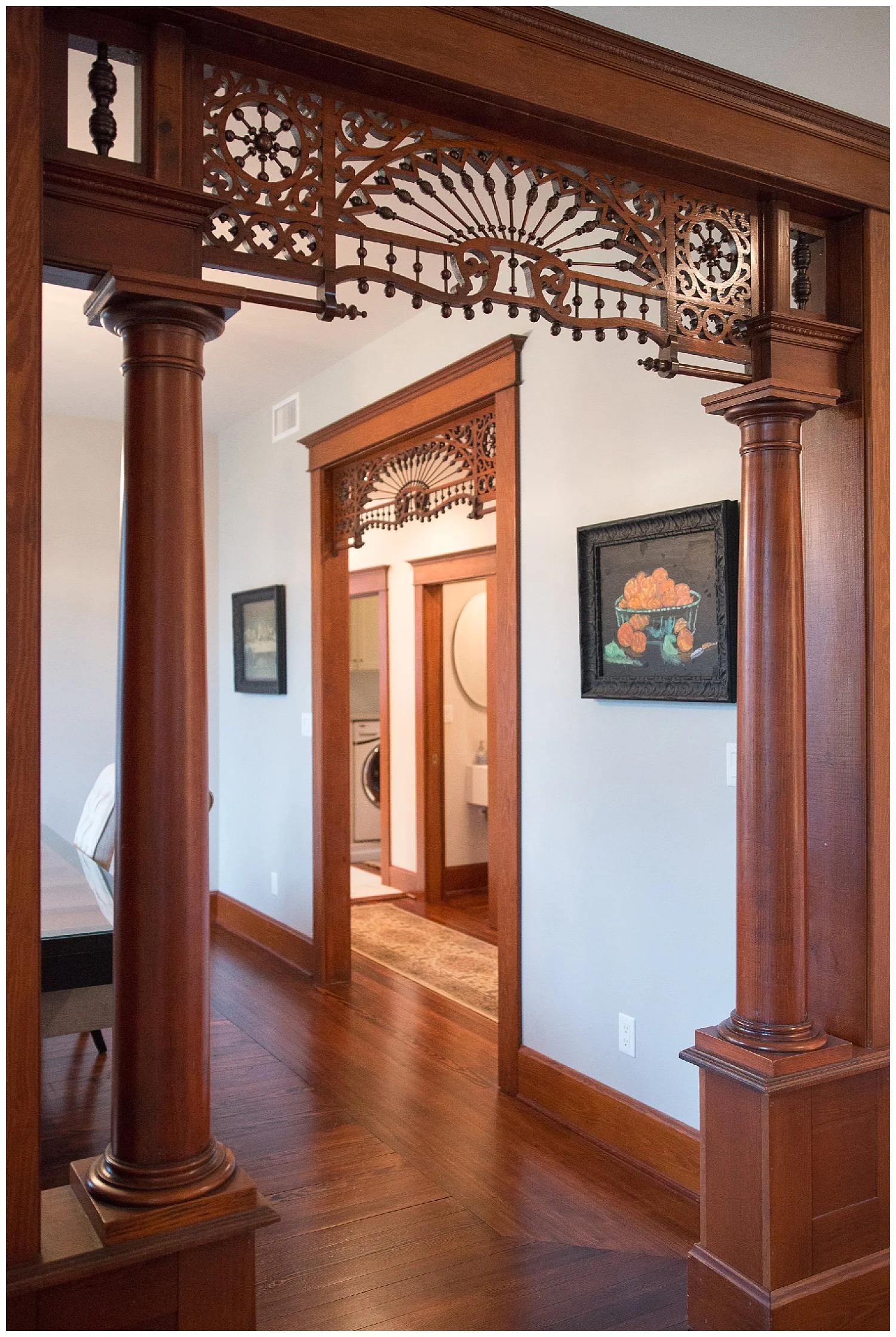 We're looking into the dining room from the living room/front door. Is this gingerbread trim fabulous or what? Leslie had it removed and cleaned "to give it another 100 years". The painted bowl of oranges on the wall came from the ARC auction . An Alice Waters print she found in the backroom at Fresh Digs was at the framers. 
