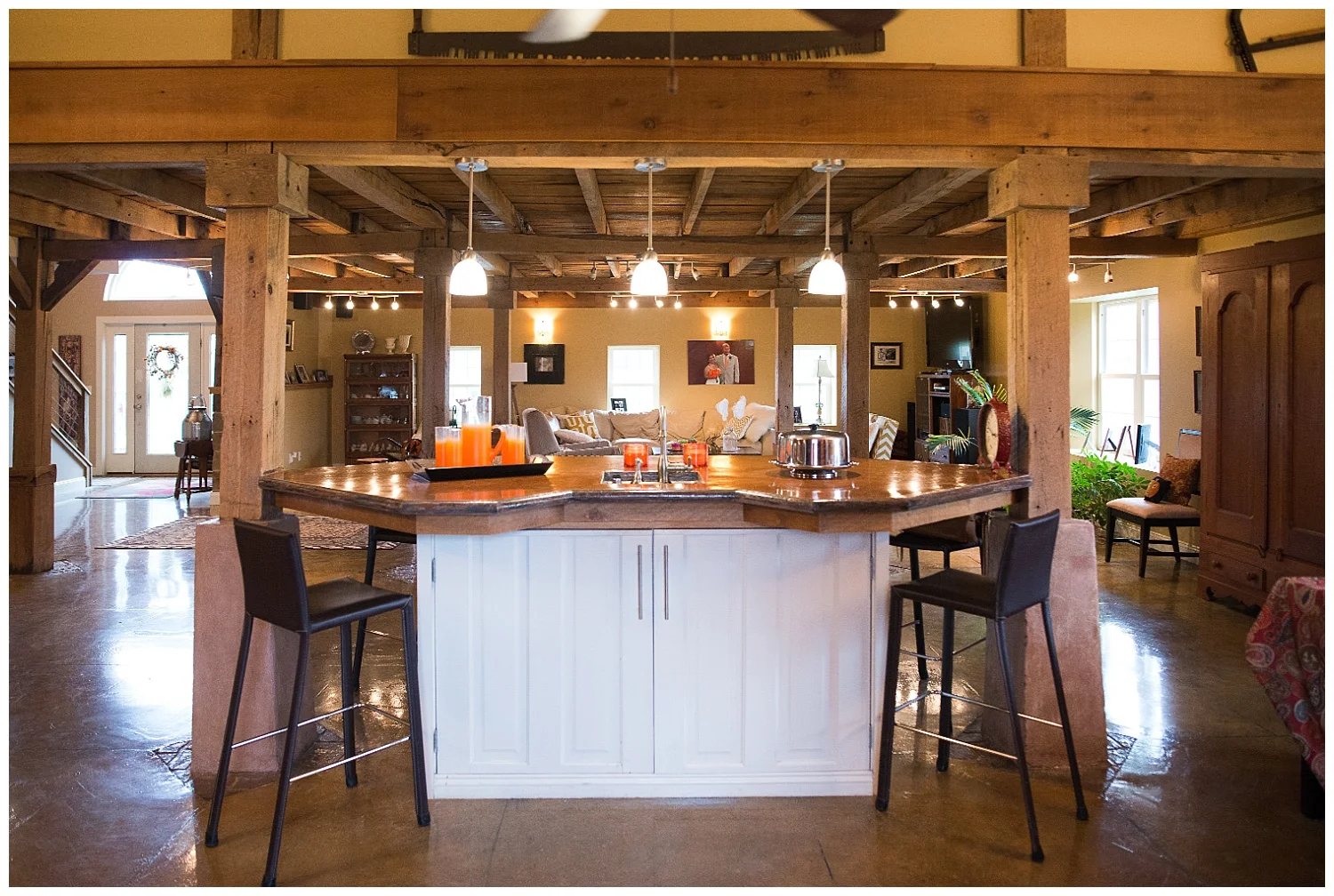 Here are the old farmhouse doors reimagined. And check out the concrete counter.