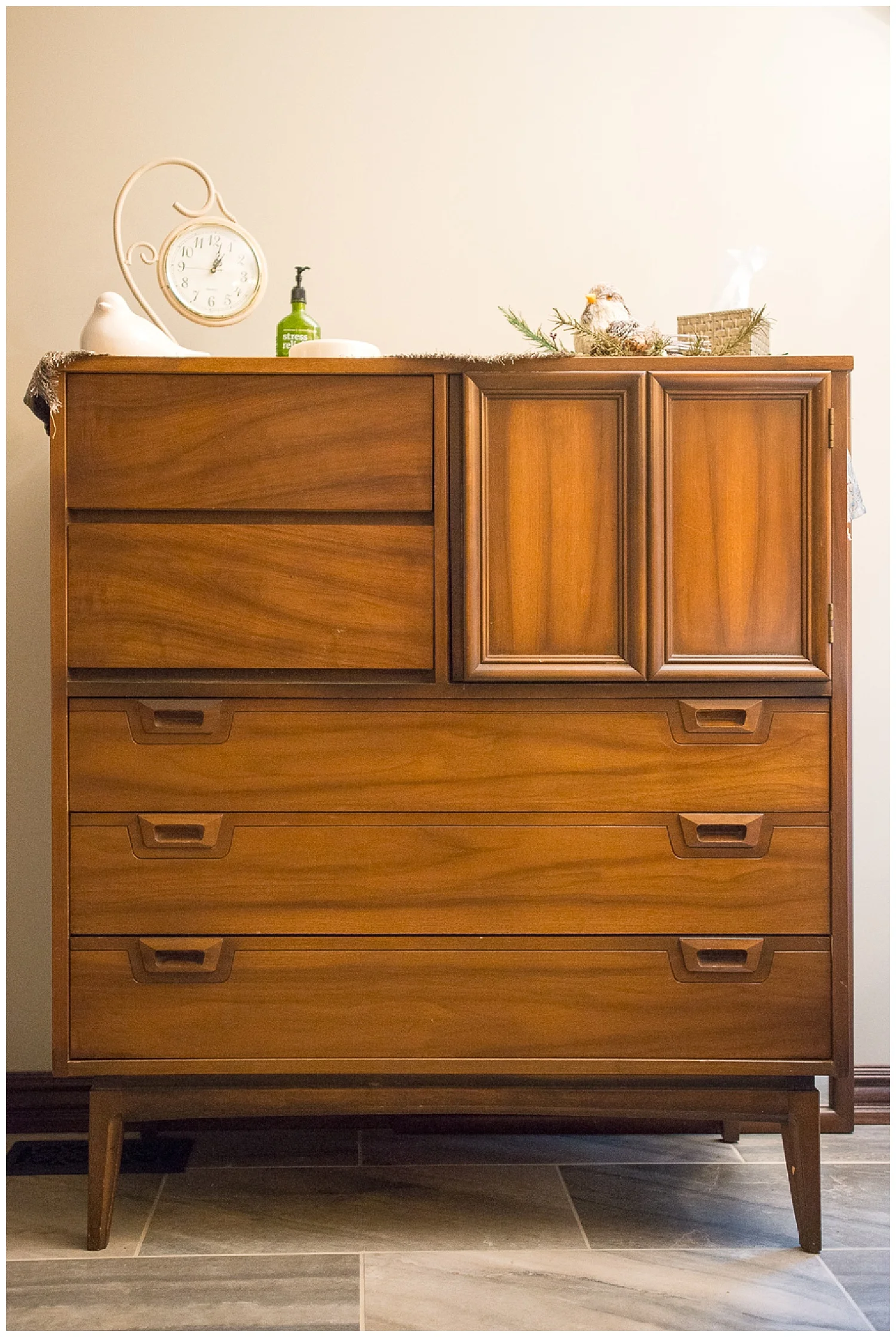 This mid-century dream is Chandra’s dad’s old dresser. She's done a great job integrating meaningful old and new pieces in this bathroom. 