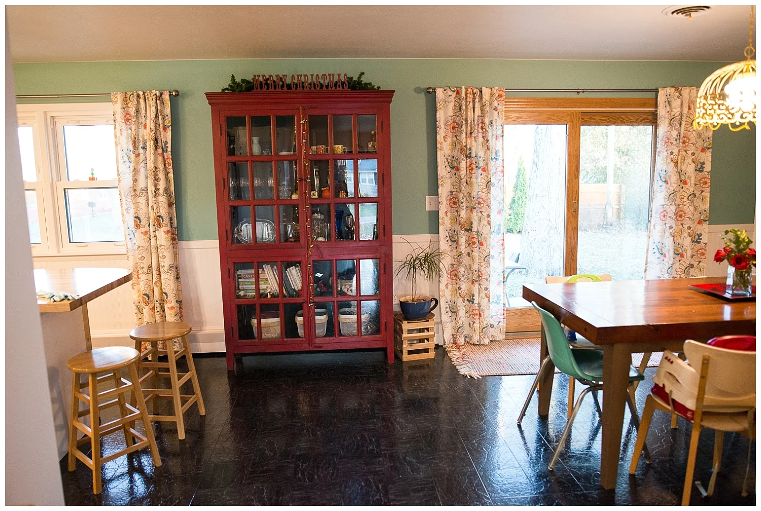 Christy eyed this gorgeous red cabinet from Crate & Barrel for years, but put off buying it until they moved into their new home. The yellow light came from Fresh Digs. 