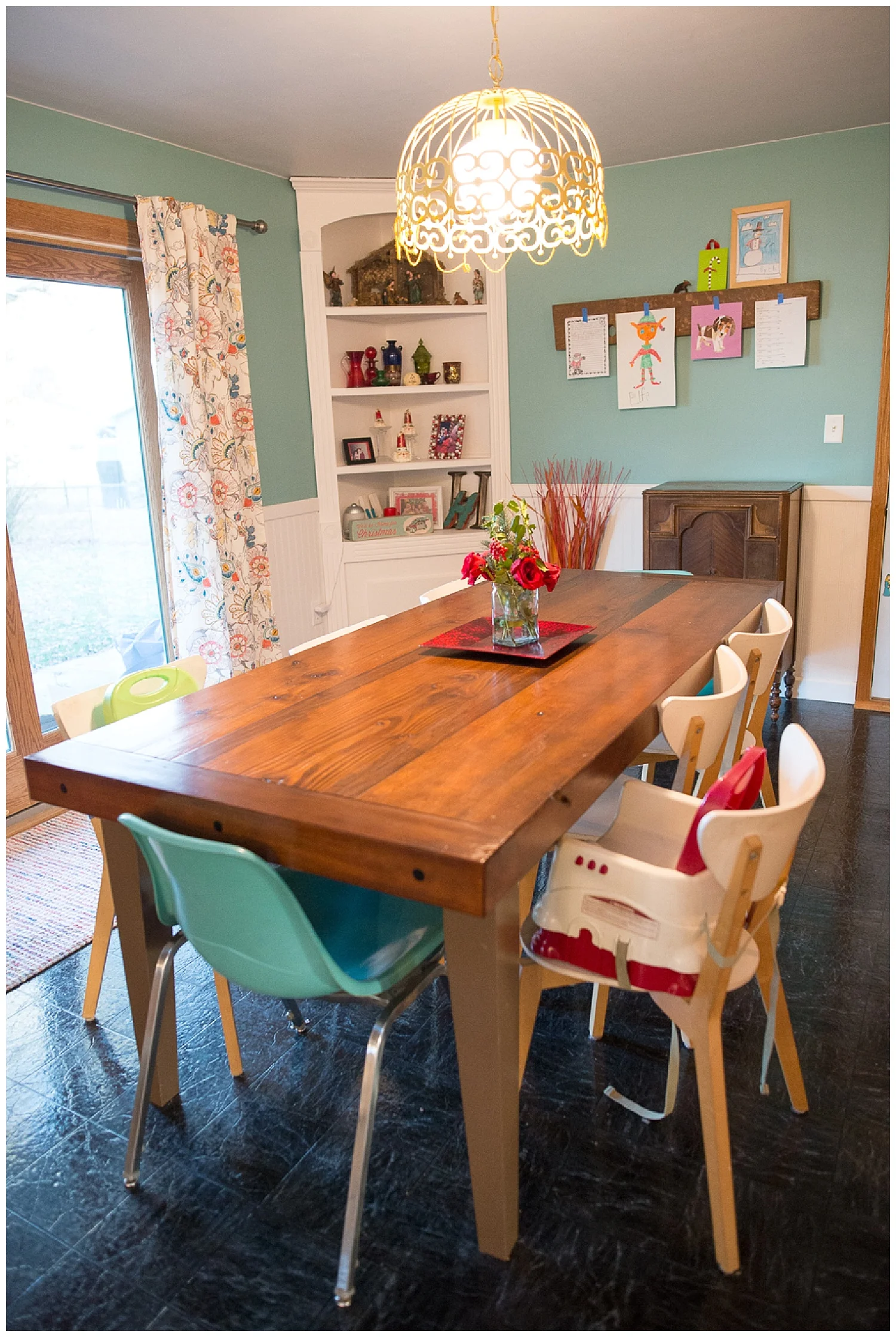 Their dining table was one of Kevin’s brother, Aaron’s , first builds and the wood to build it was sourced from an old Equity storage building. Kevin saw them tearing it down, asked for the wood and he and his dad grabbed the beams. The teal chairs came from Fresh Digs and the white ones from Ikea.