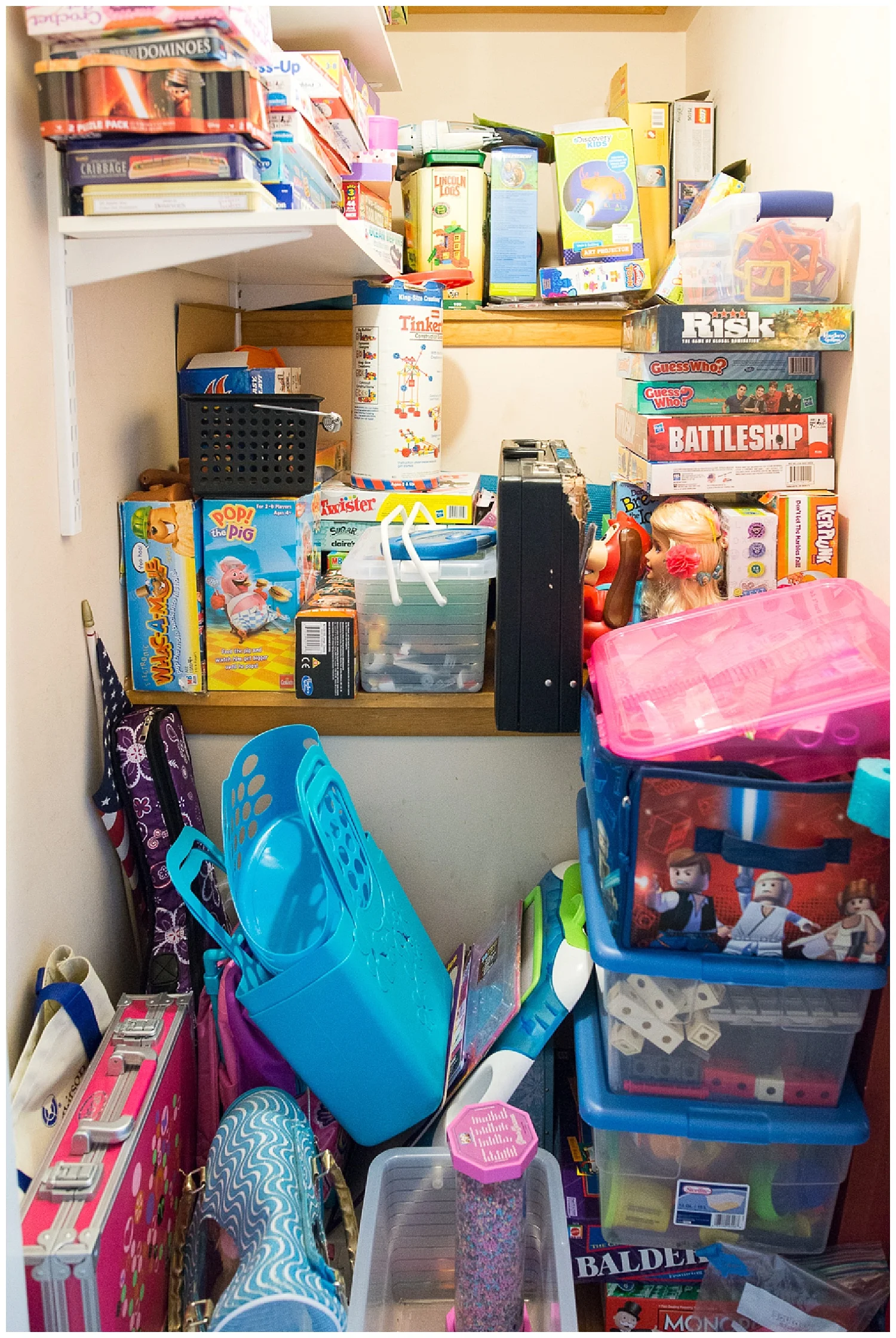 I love peeking into people’s closets. This stairwell leading up to the attic is the perfect spot for games, games and more games.