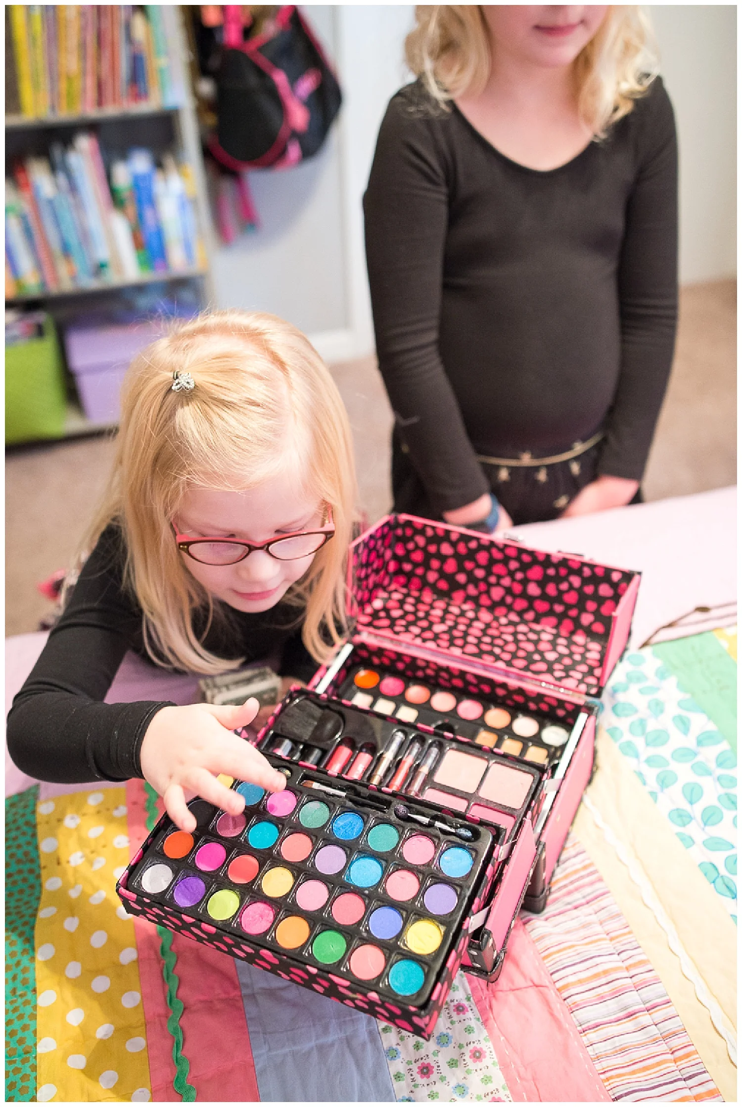 Tess’s favorite thing is her brightly colored makeup kit and Lily’s is, well, her makeup kit, albeit a little less bright.