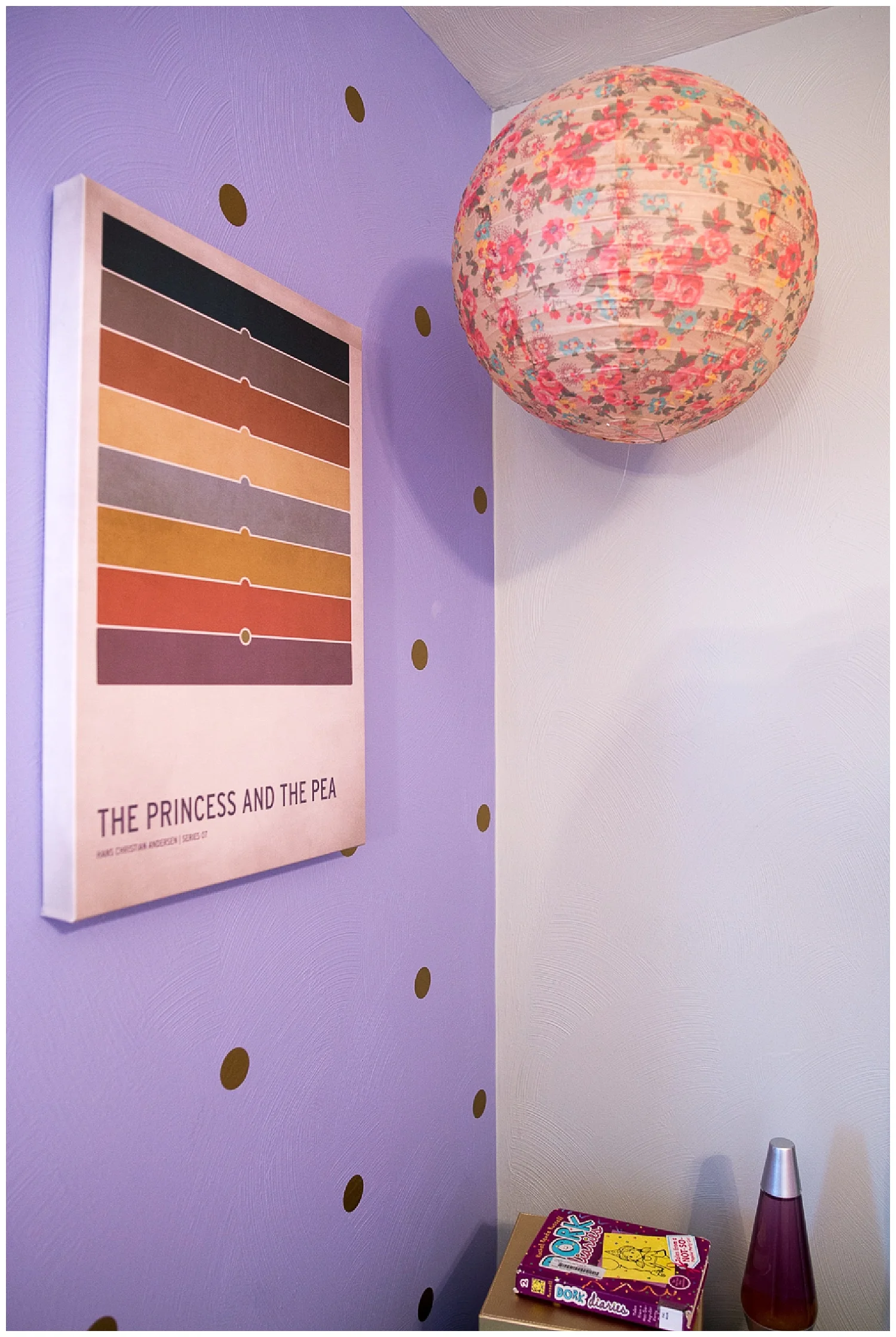 Monica found the Princess and the Pea wall hanging on Amazon and the paper lantern came from Fresh Digs.