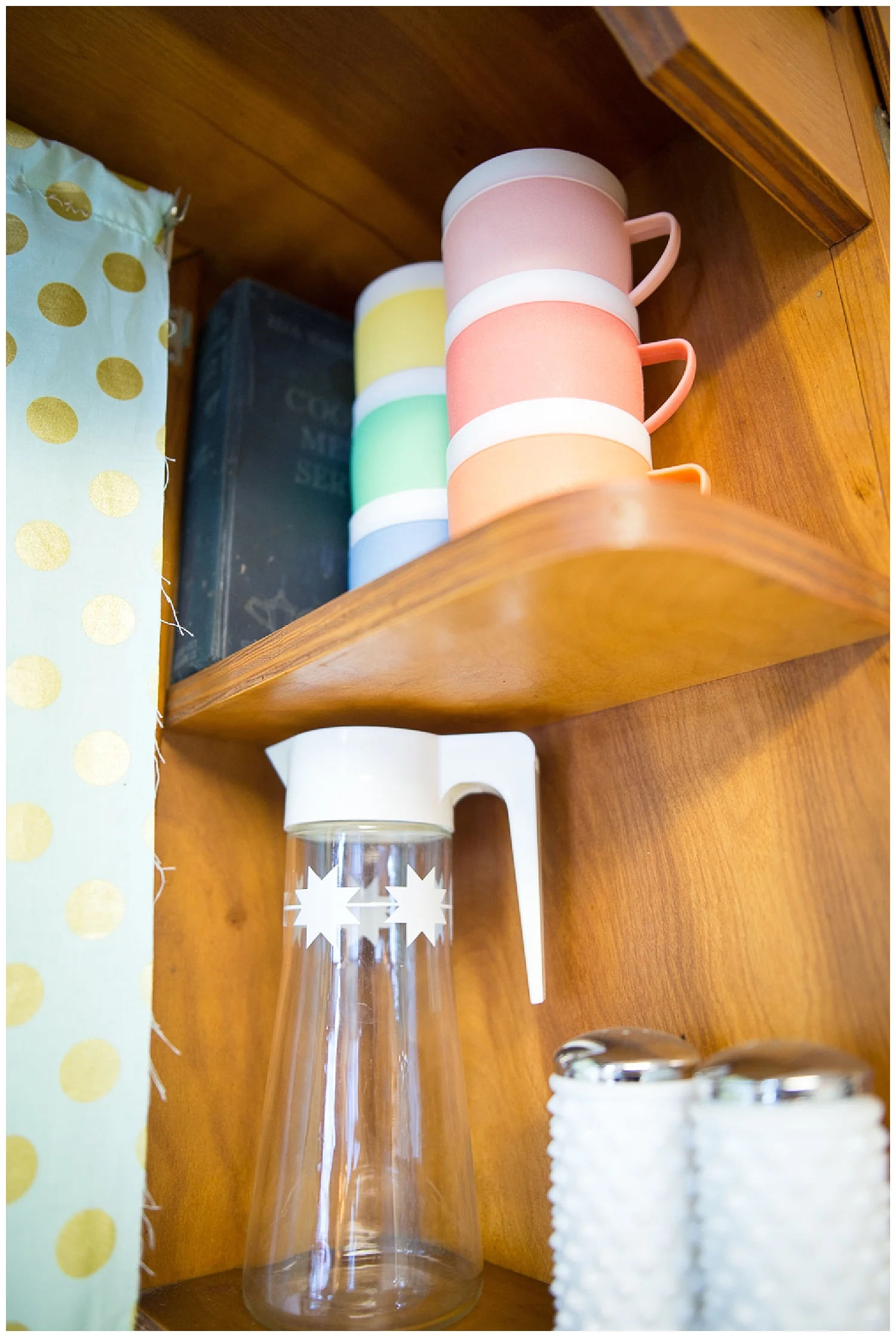 She adds fun color to her kitchen with the set of colorful vintage plasticware cups she got from Fresh Digs. The hobnail salt and pepper shakers were a fantastic garage sale score. 