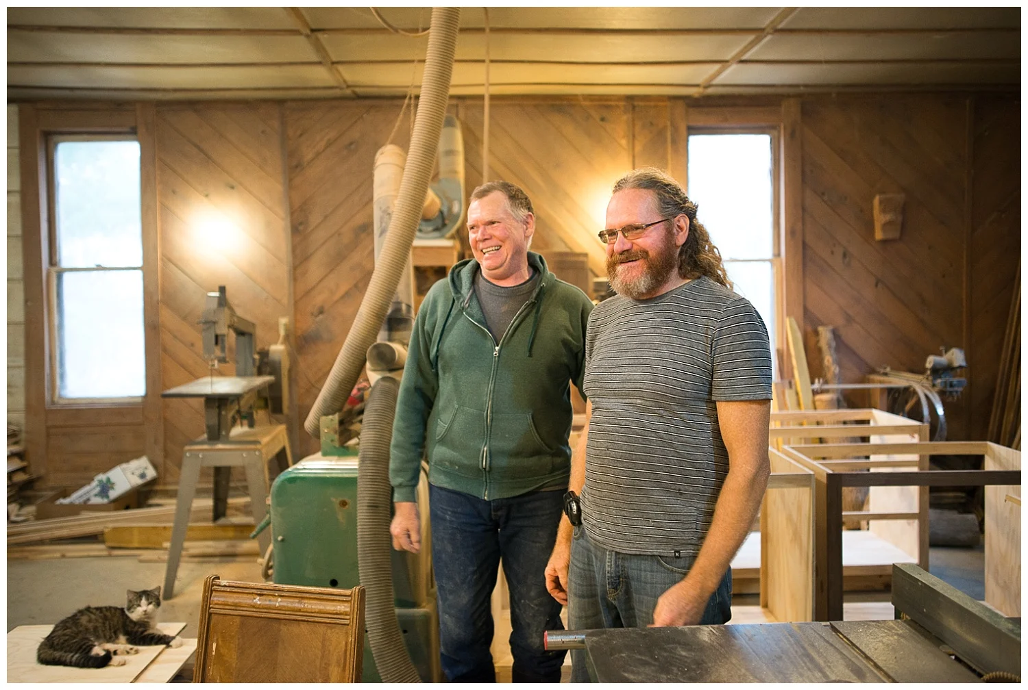 From left: Precious the shop cat, David Gould and Rick Gould.