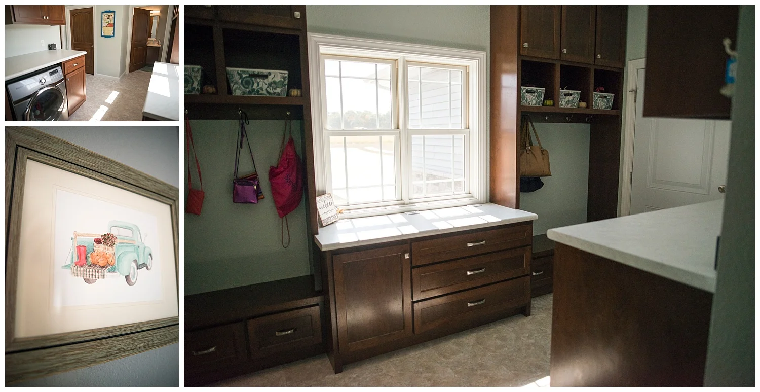 Just off the kitchen is the mudroom and half-bath. Again with loads of custom cabinets, this workhorse of a room looks very neat and tidy. Hanging on the wall is a framed Whitney Ruger watercolor print. 
