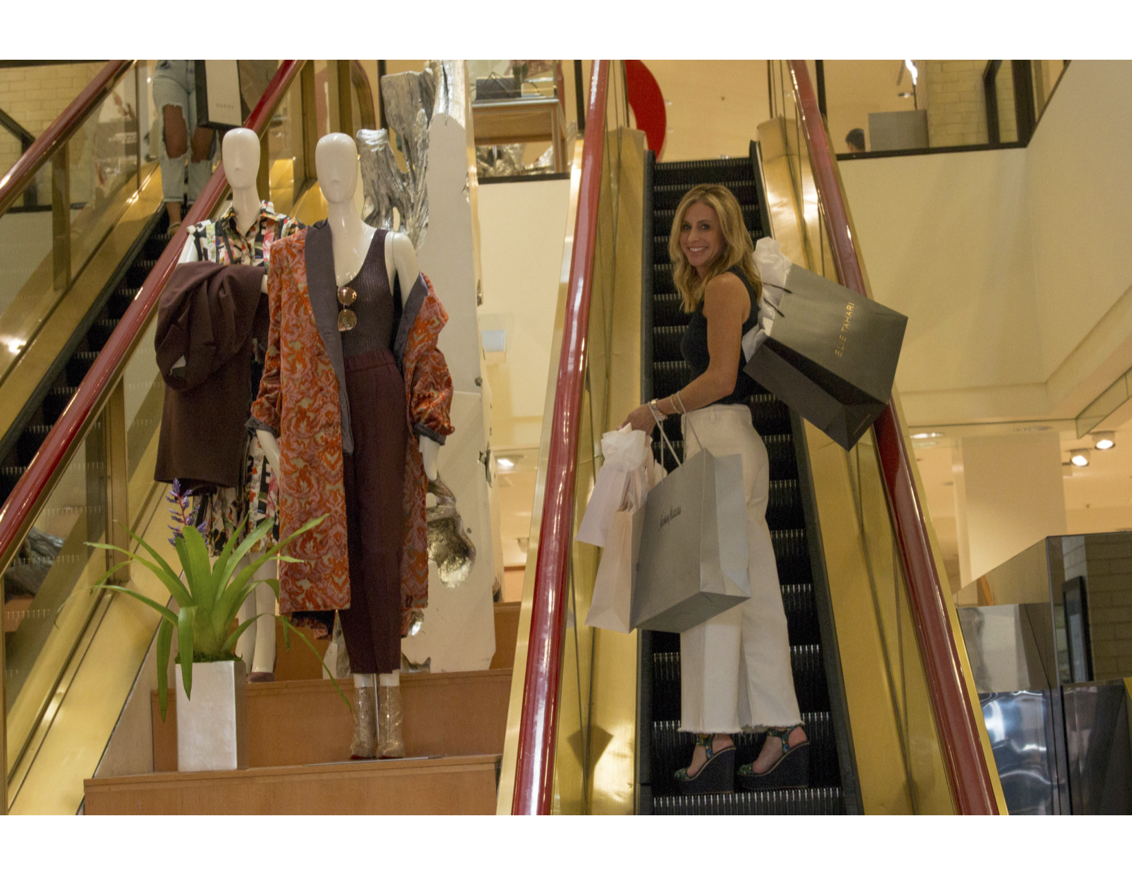Amy shopping escalator.png